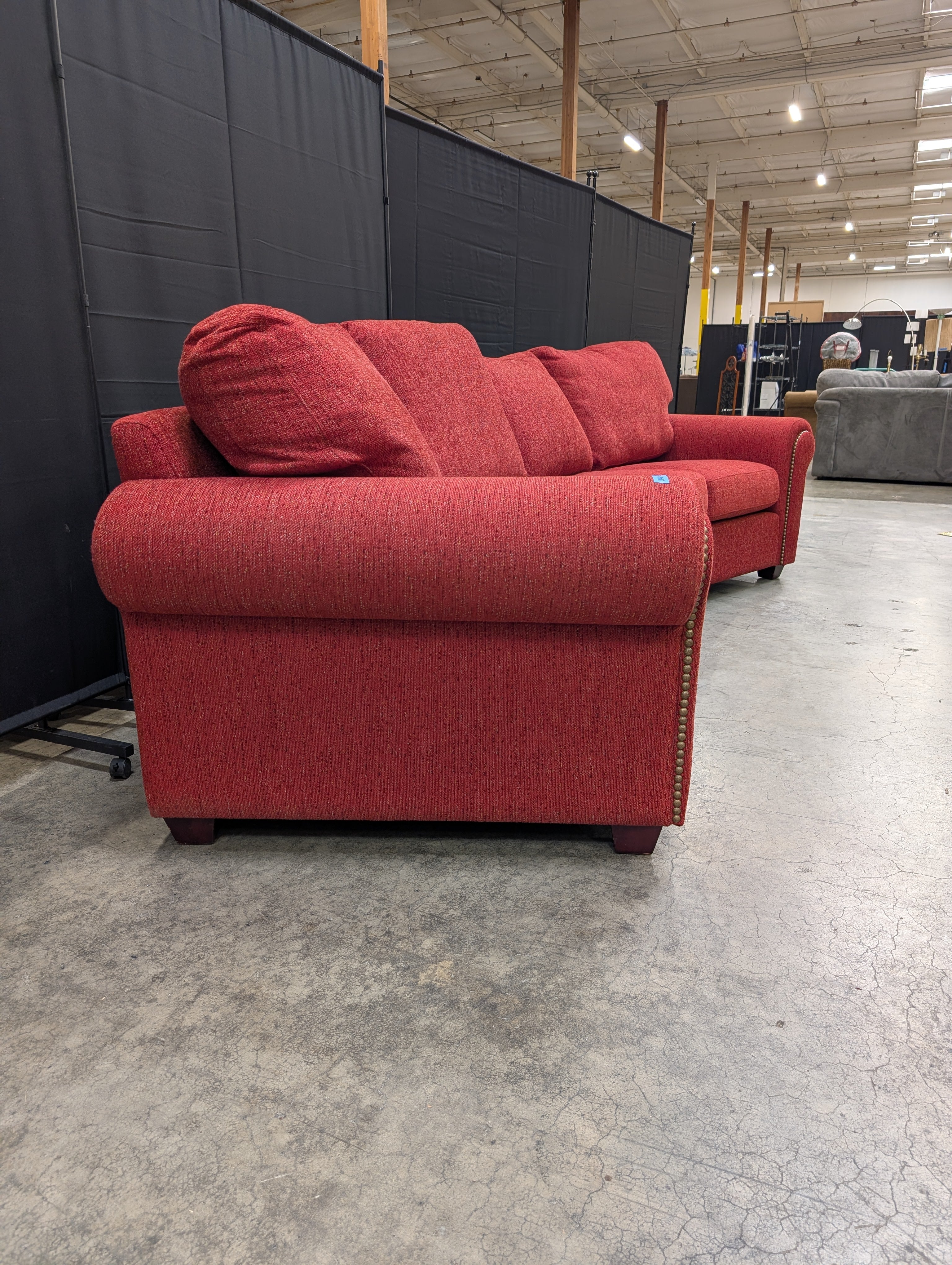 Curved Red Textured Fabric Couch with Nailhead Trim