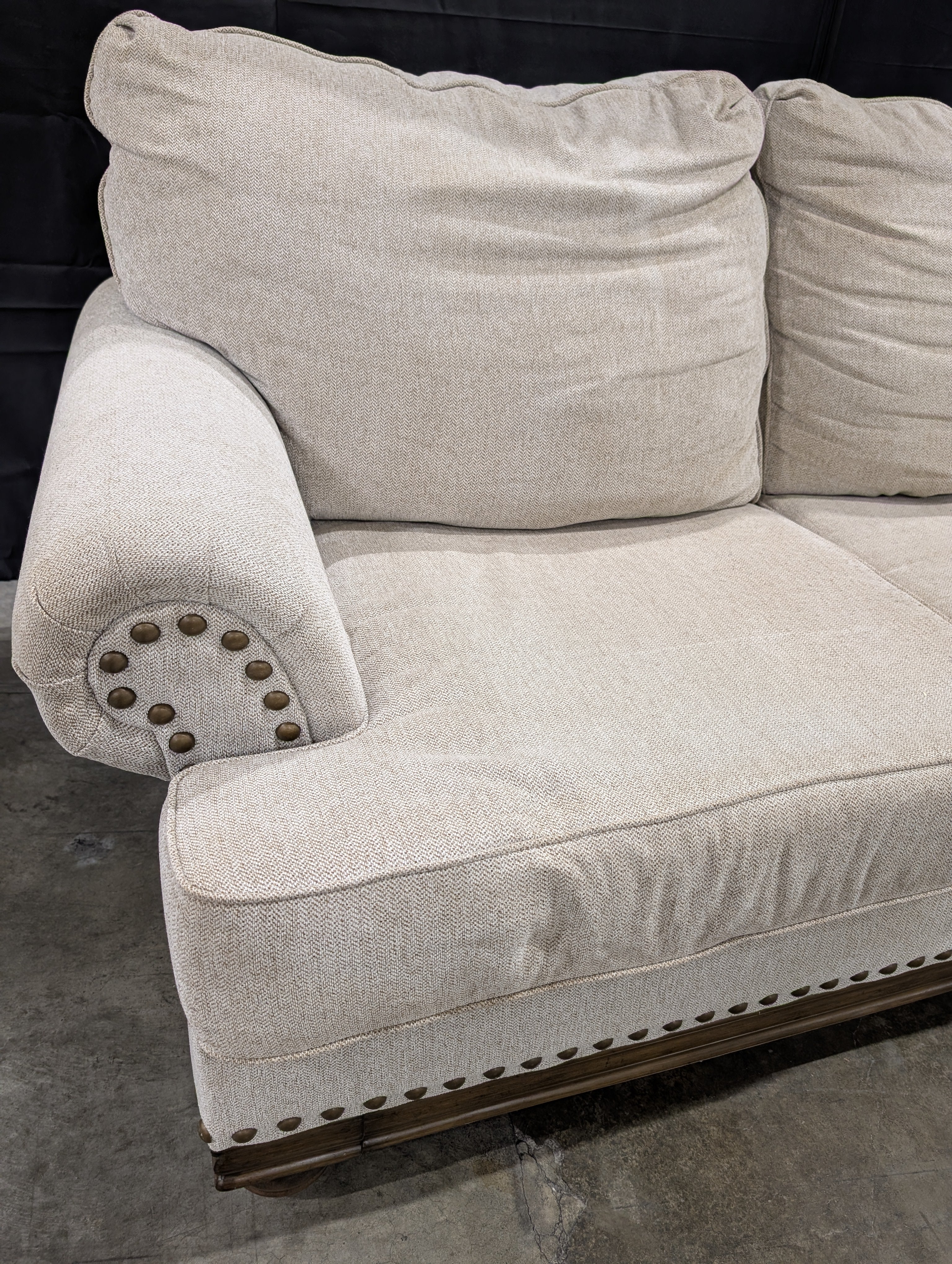 Neutral Three-Cushion Nail Trim Sofa