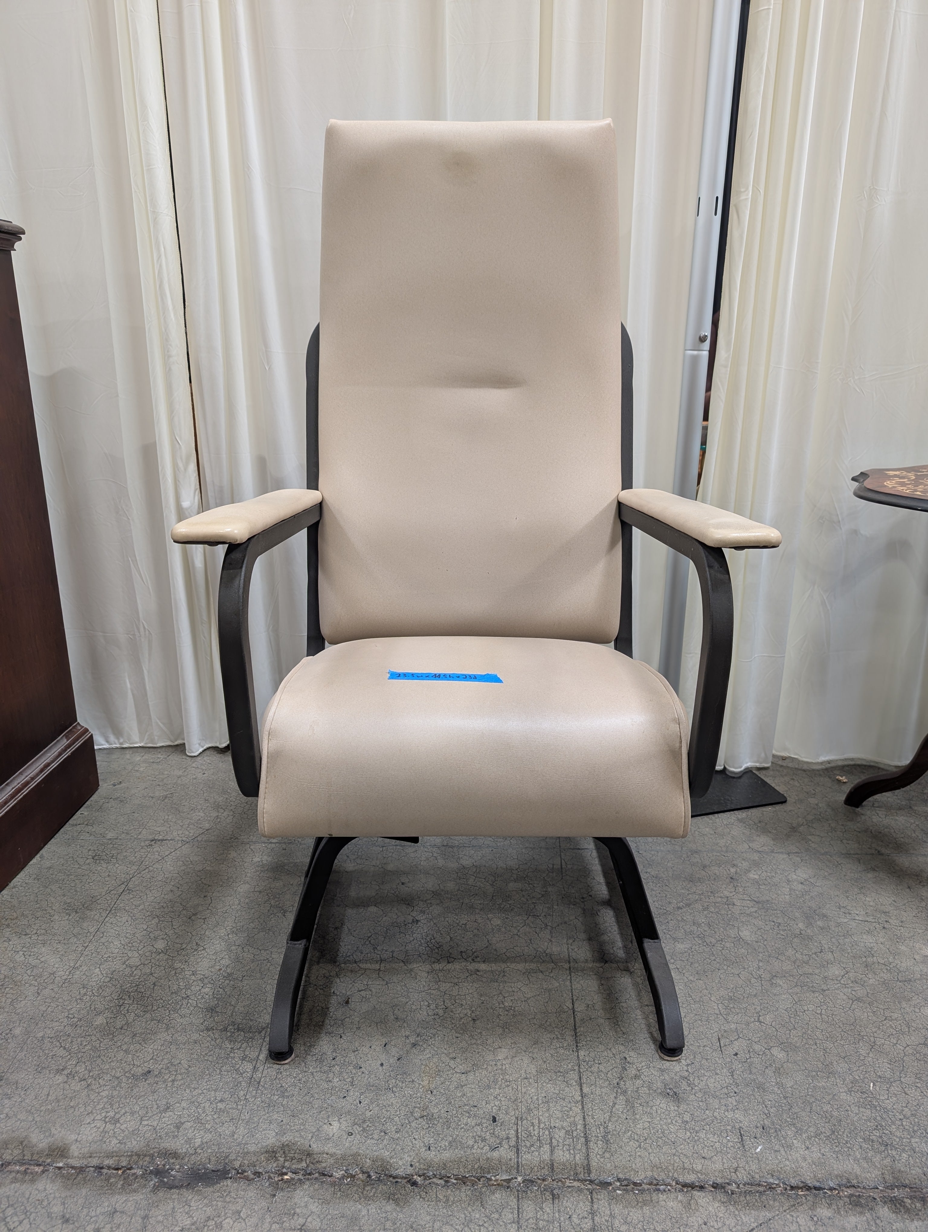 Cream Upholstered High-Back Chair with Metal Frame