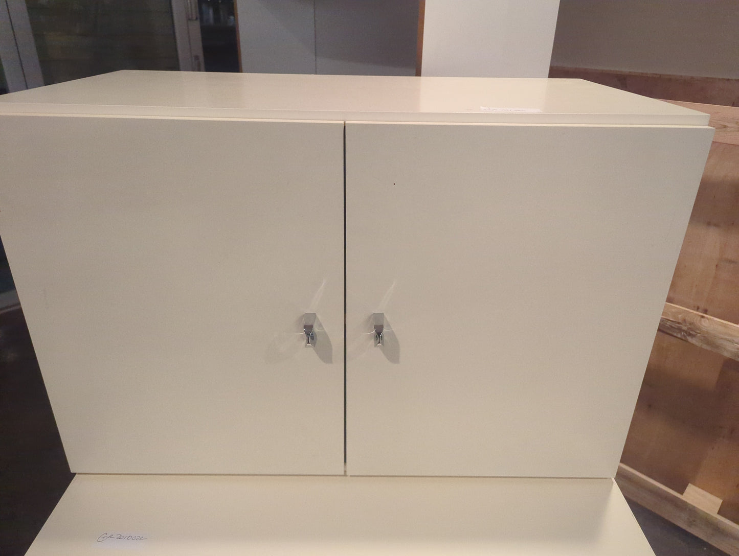 White cabinet with metal pulls