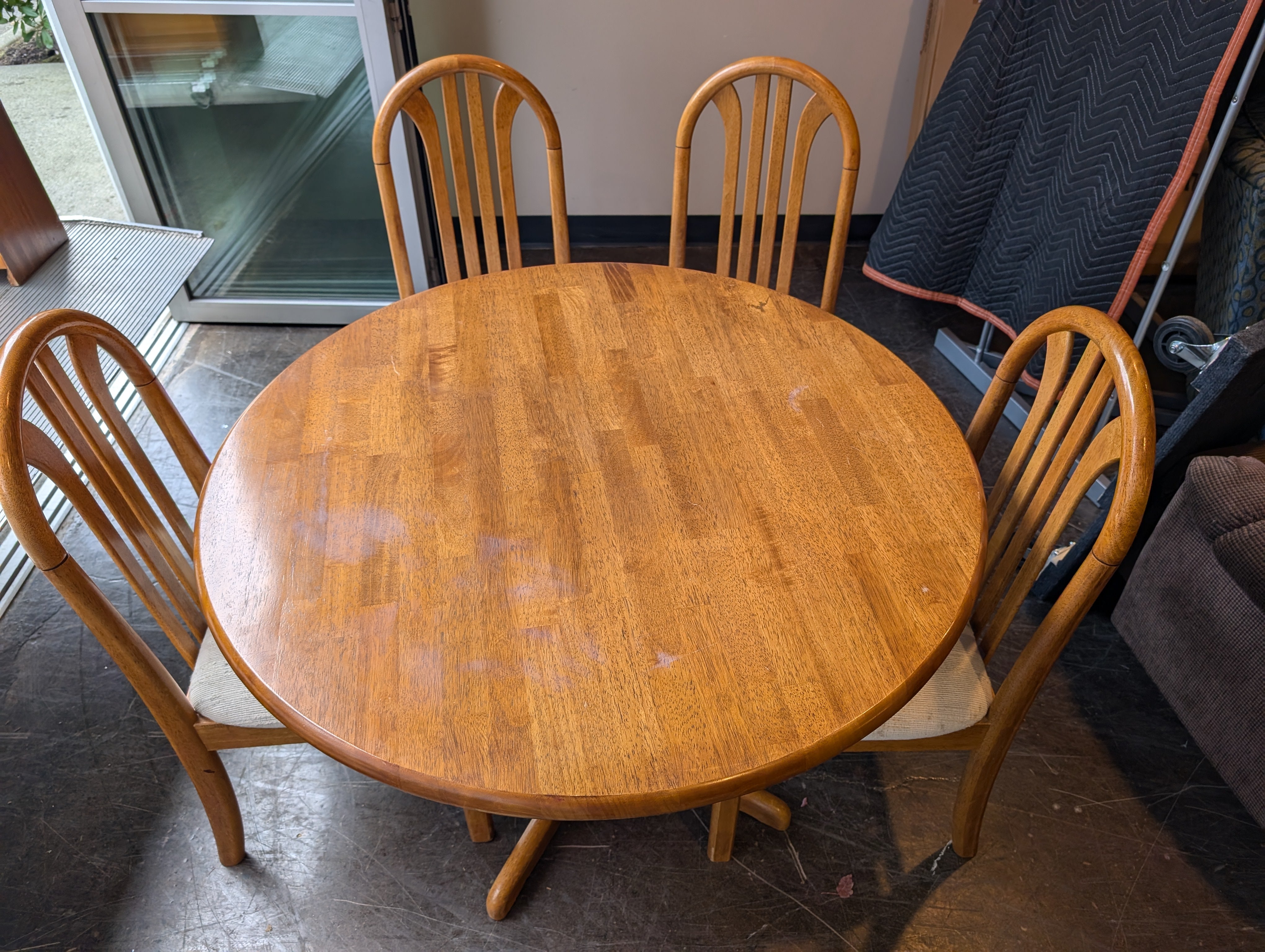 Five-Piece Wood Dining Set with Round Table and Padded Chairs