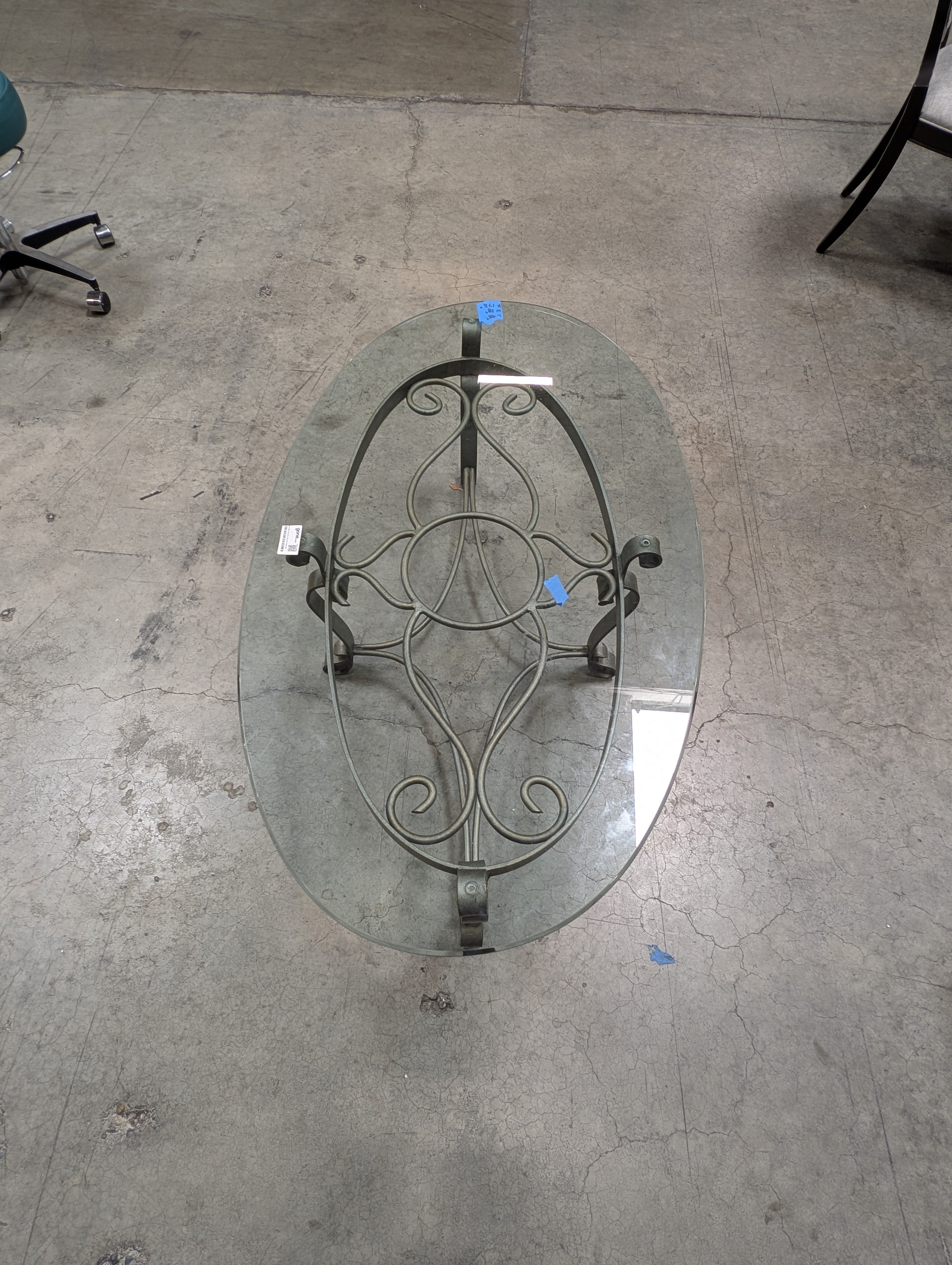 Oval Glass Top Coffee Table with Ornate Scrolled Metal Base