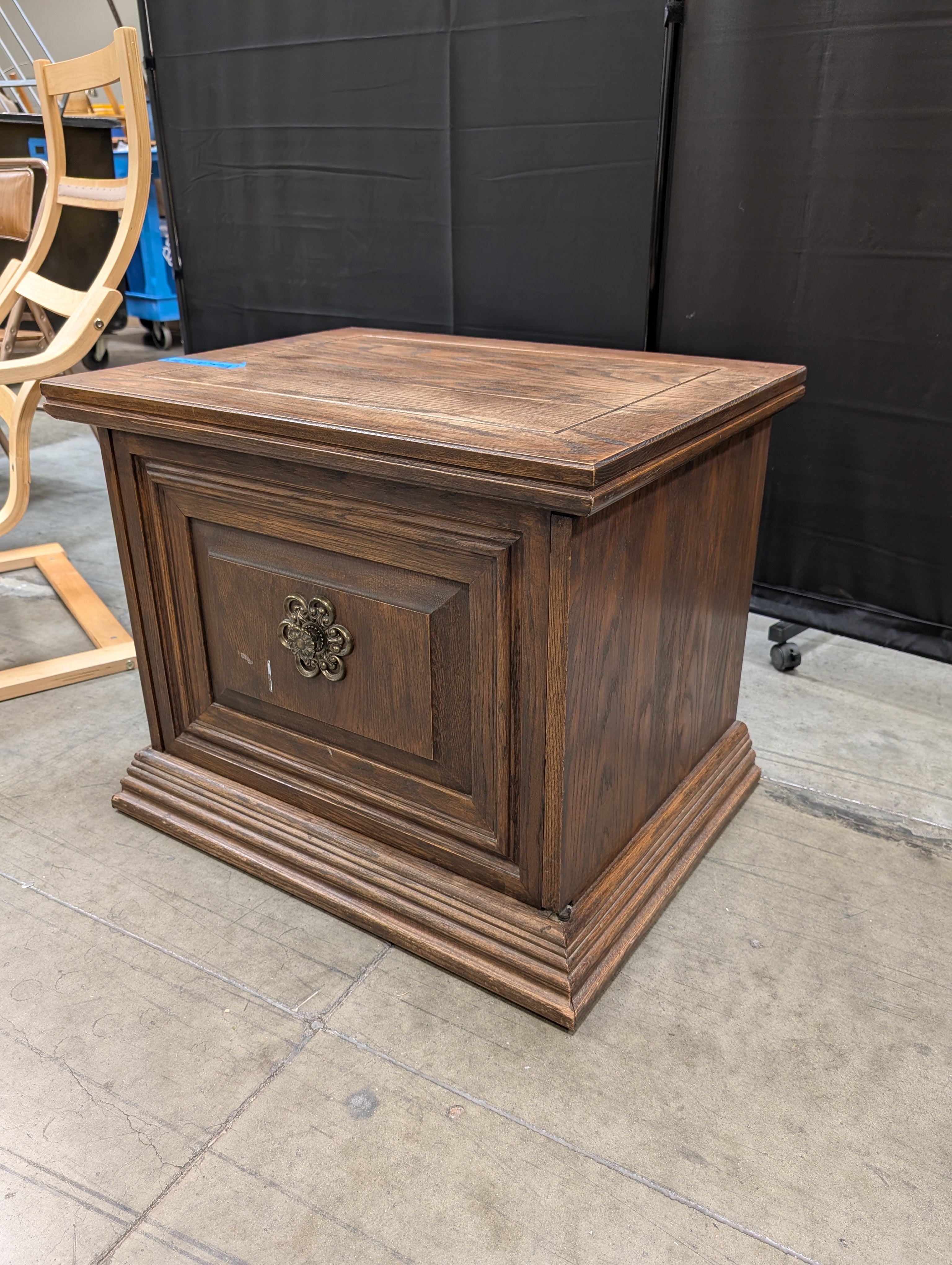 Traditional Hardwood Nightstand with Ornate Medallion Pull