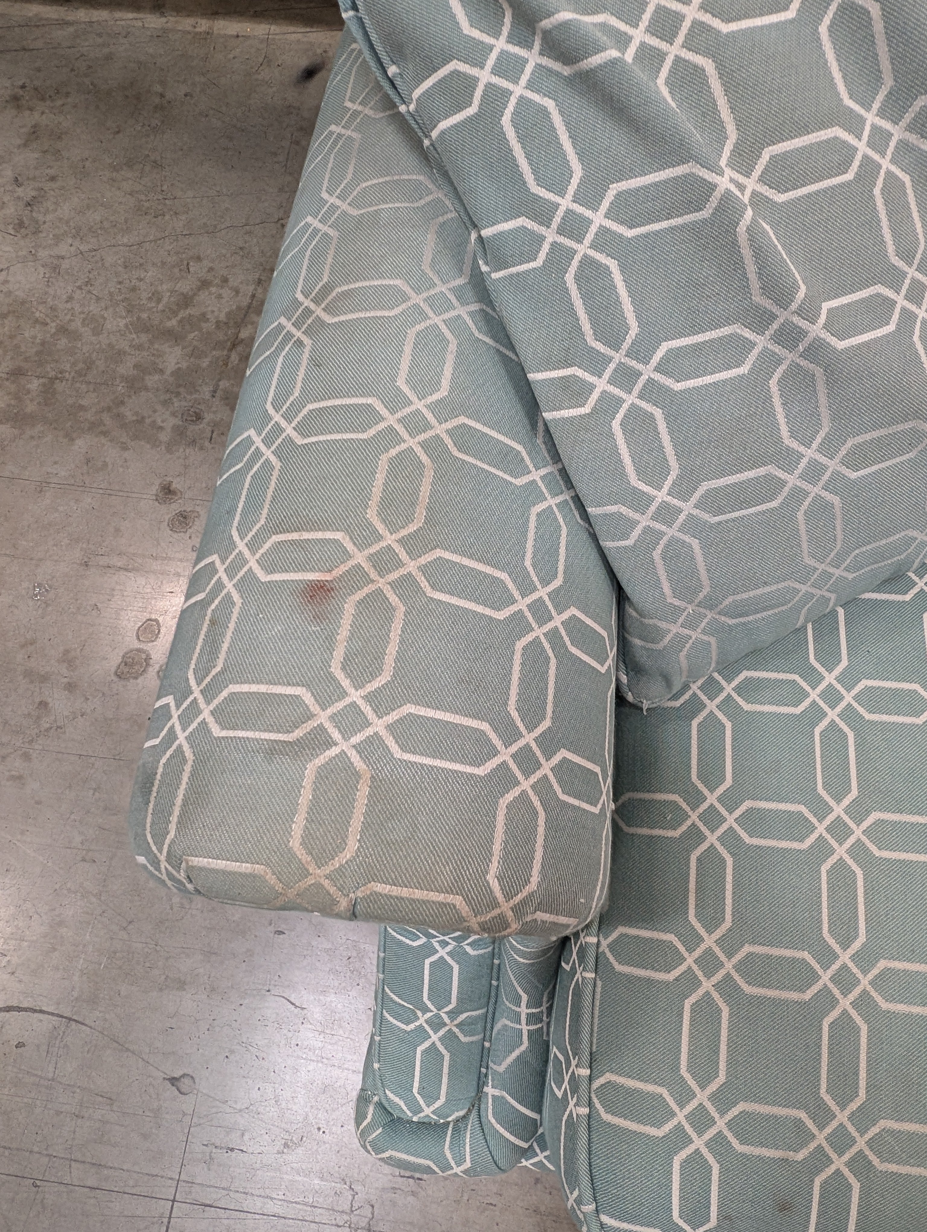 Comfortable Armchair with Green Wavy Pattern Slipcover