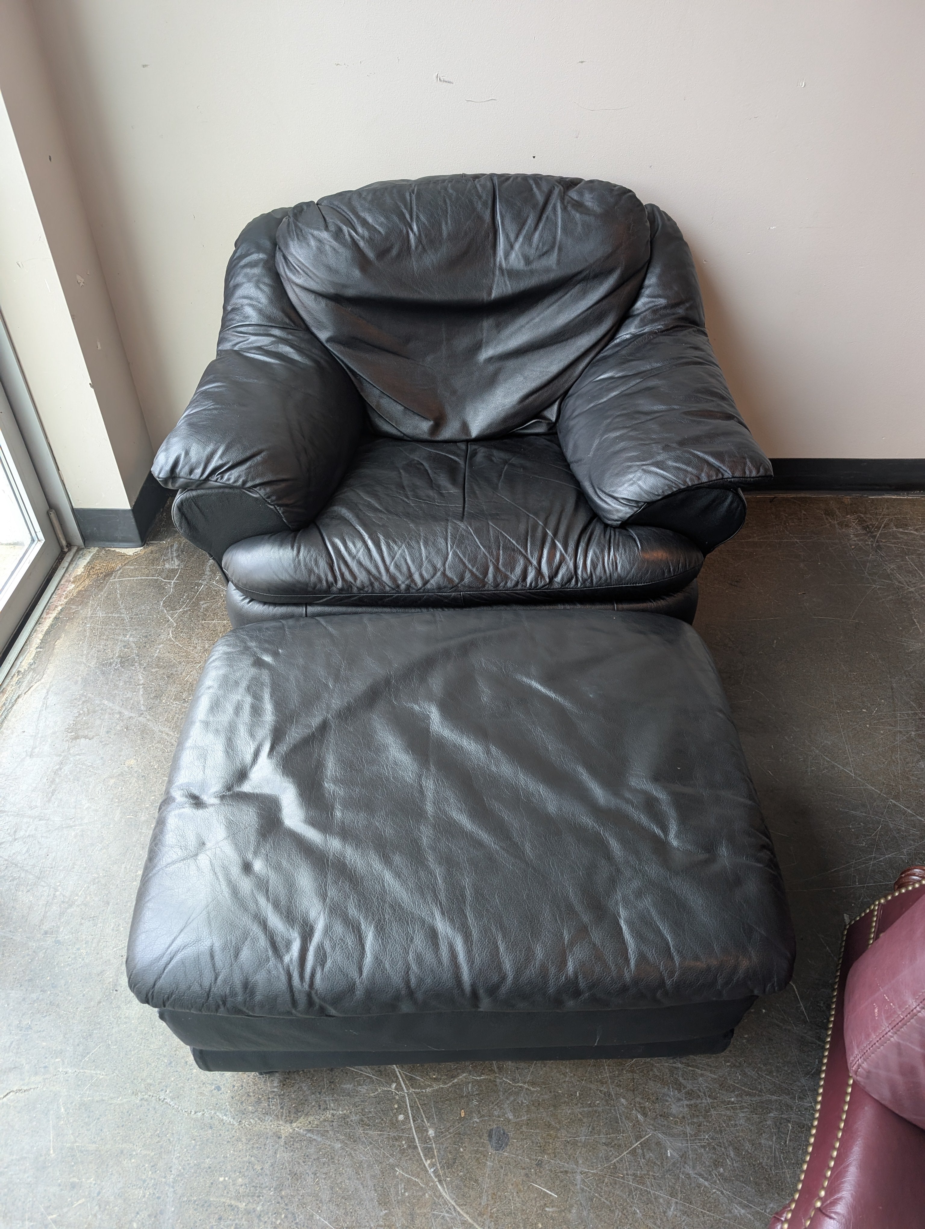 Plush Black Leather Armchair and Ottoman Set