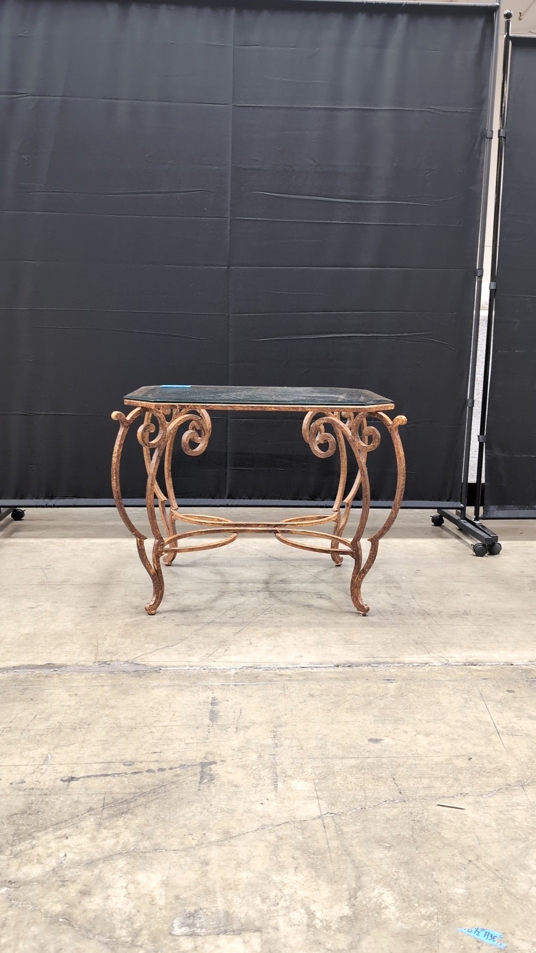 Octagonal Glass Top Accent Table with Scrollwork Metal Base