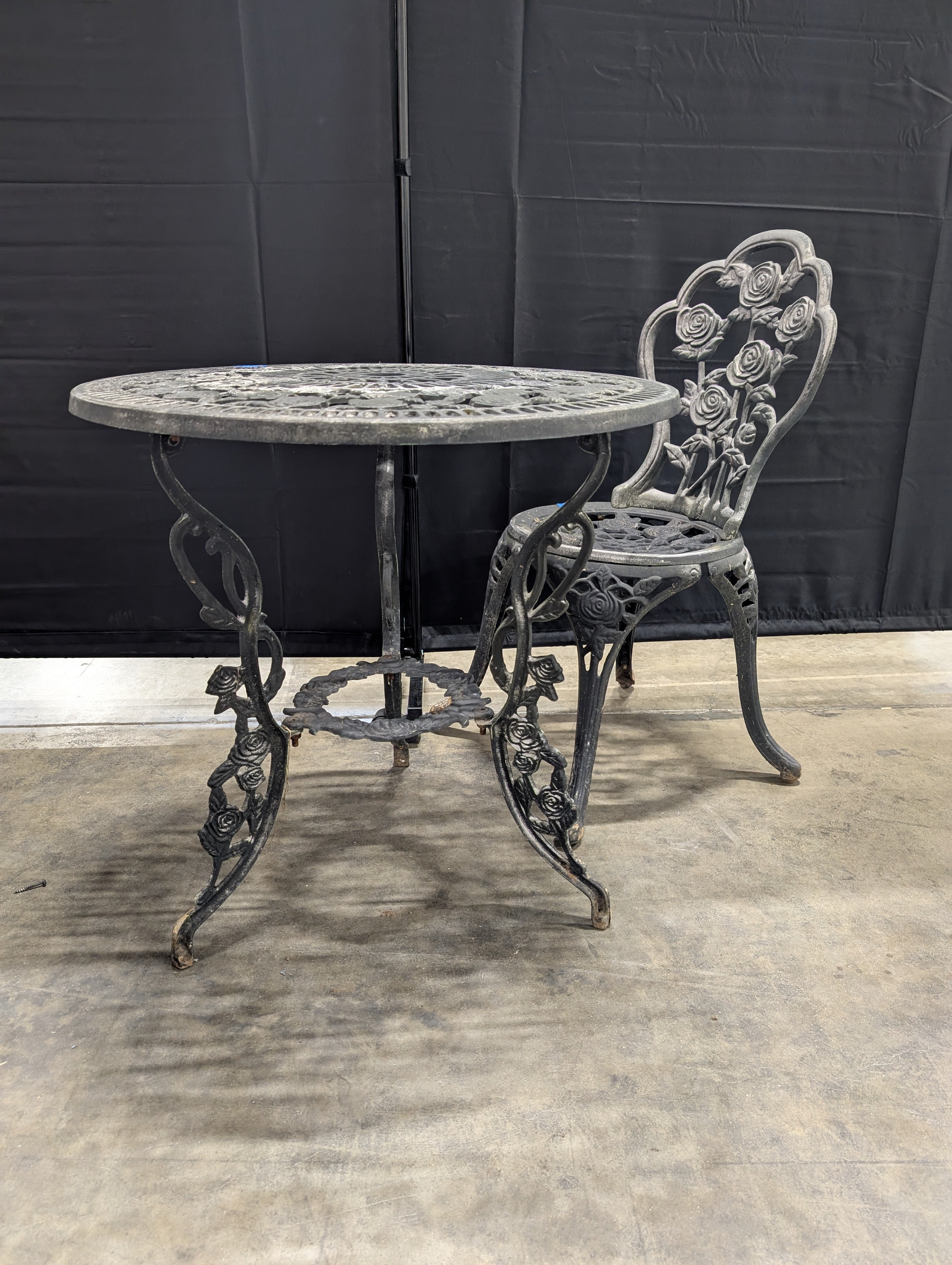 Round Black Cast Iron End Table with Floral Pattern