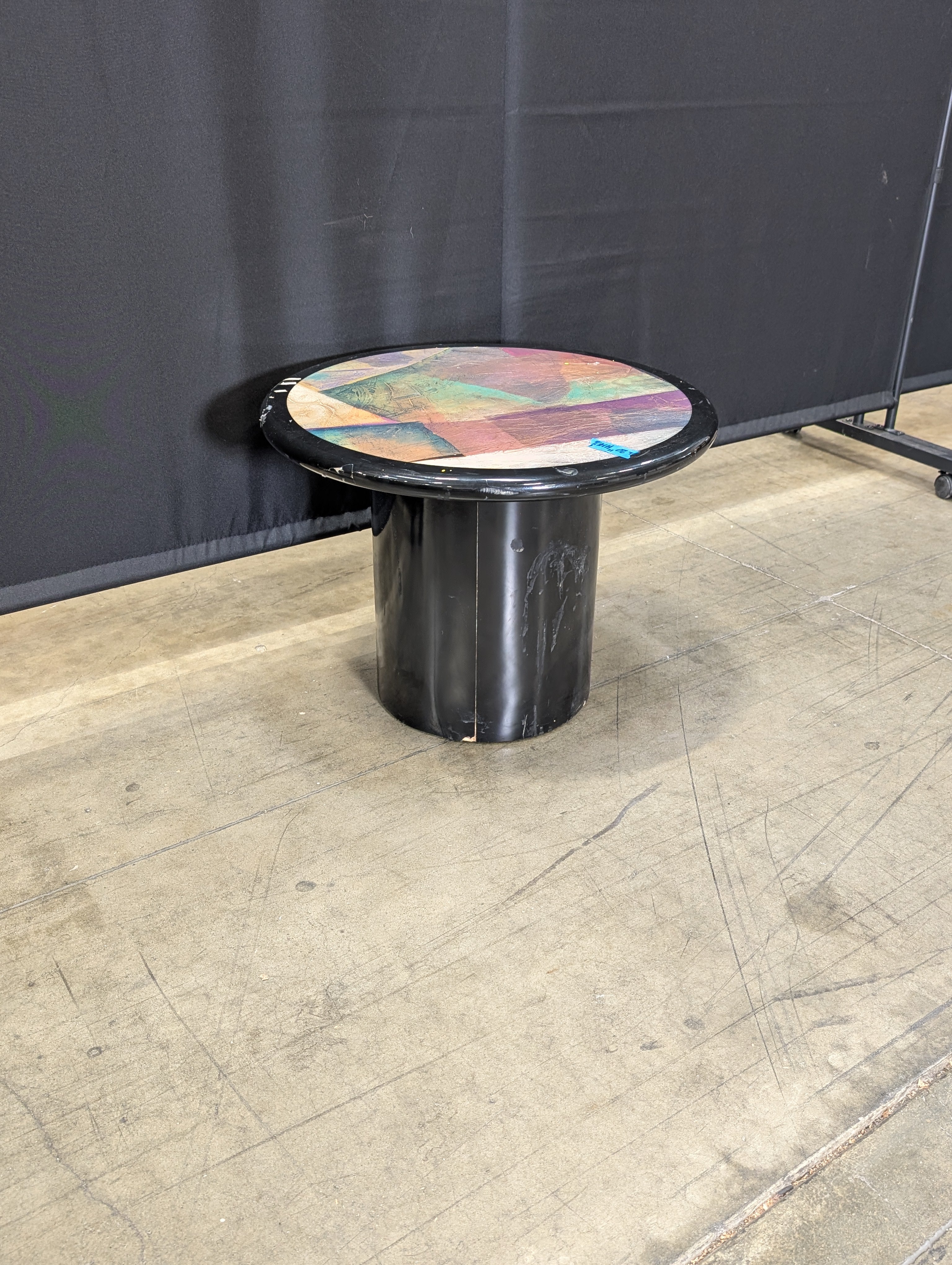 Striking Round Pedestal Coffee Table with Iridescent Top