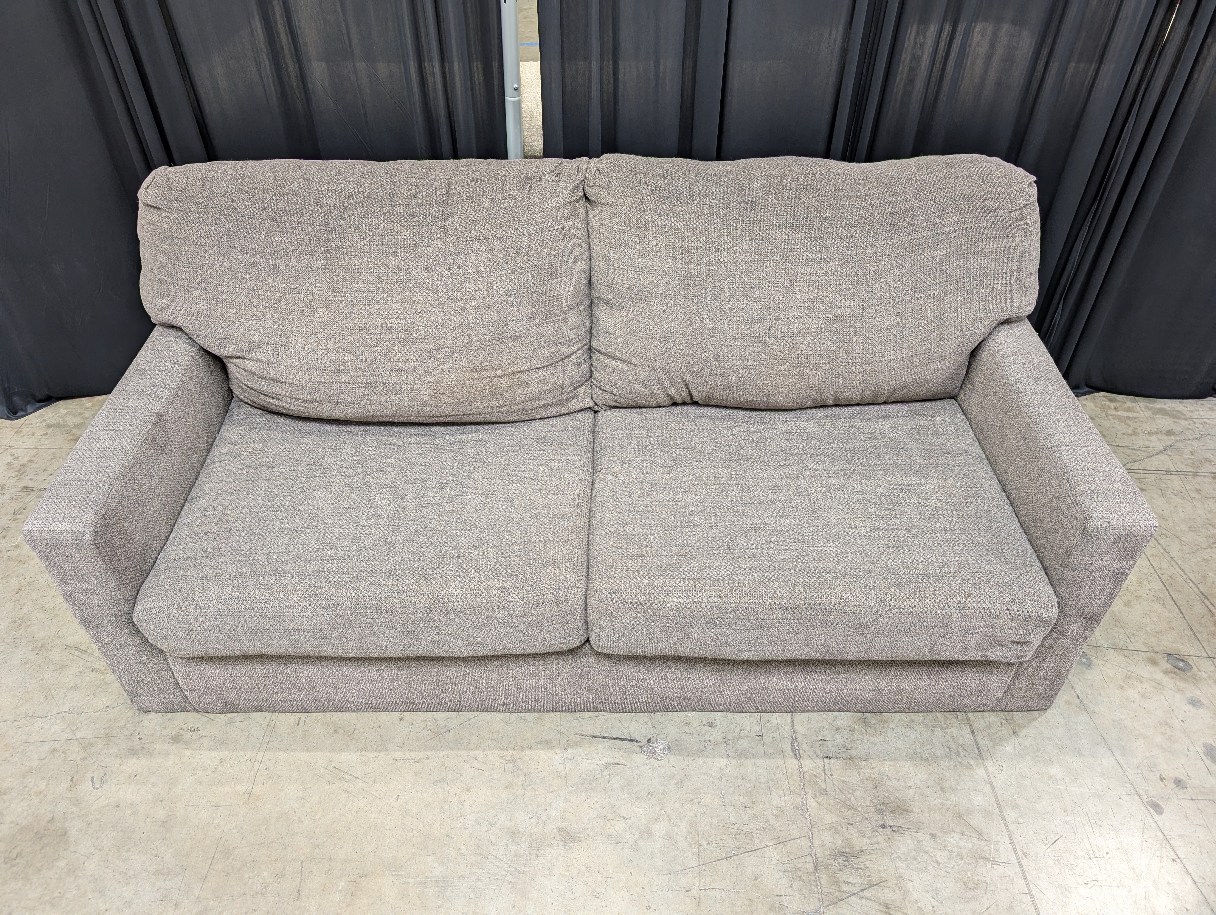 Grey Textured Fabric Two-Seater Couch with Track Arms