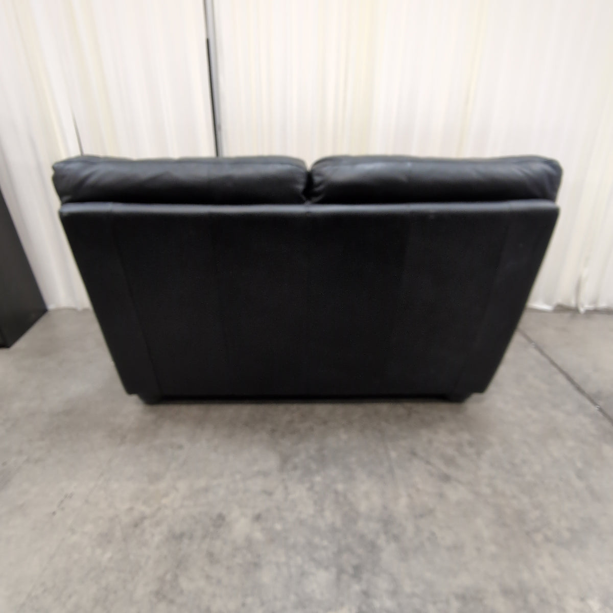 Black Leather Three-Seat Couch with Padded Arms