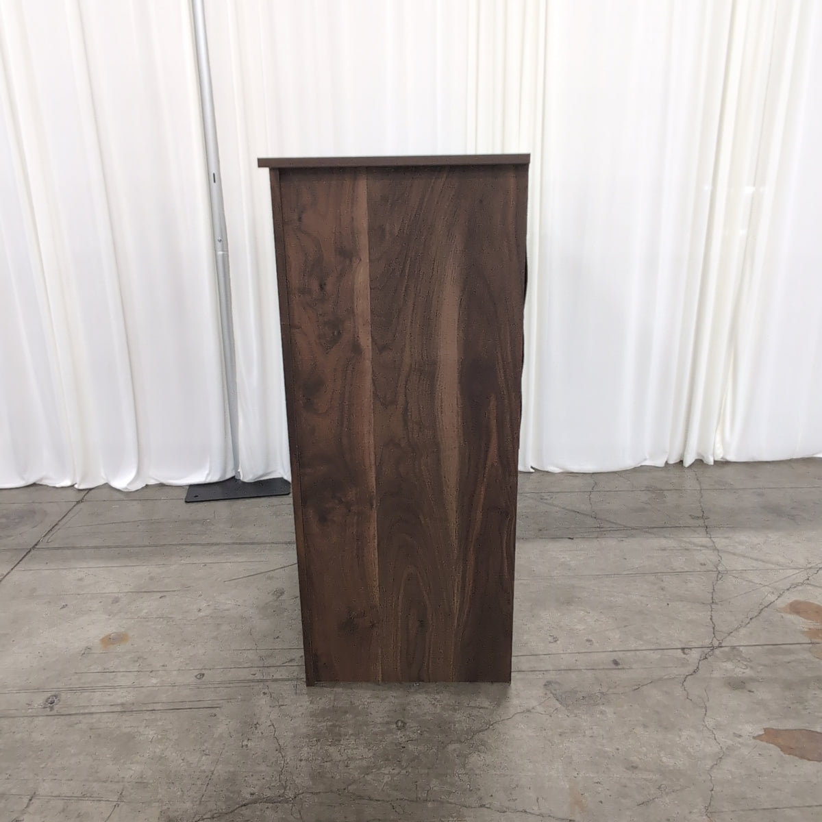 Dark Wood Four-Drawer Dresser with Metal Pulls