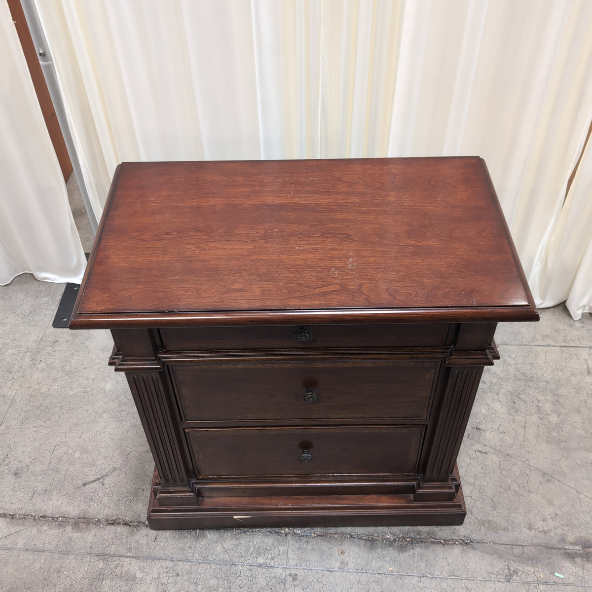 Traditional Dark Wood Three-Drawer Nightstand