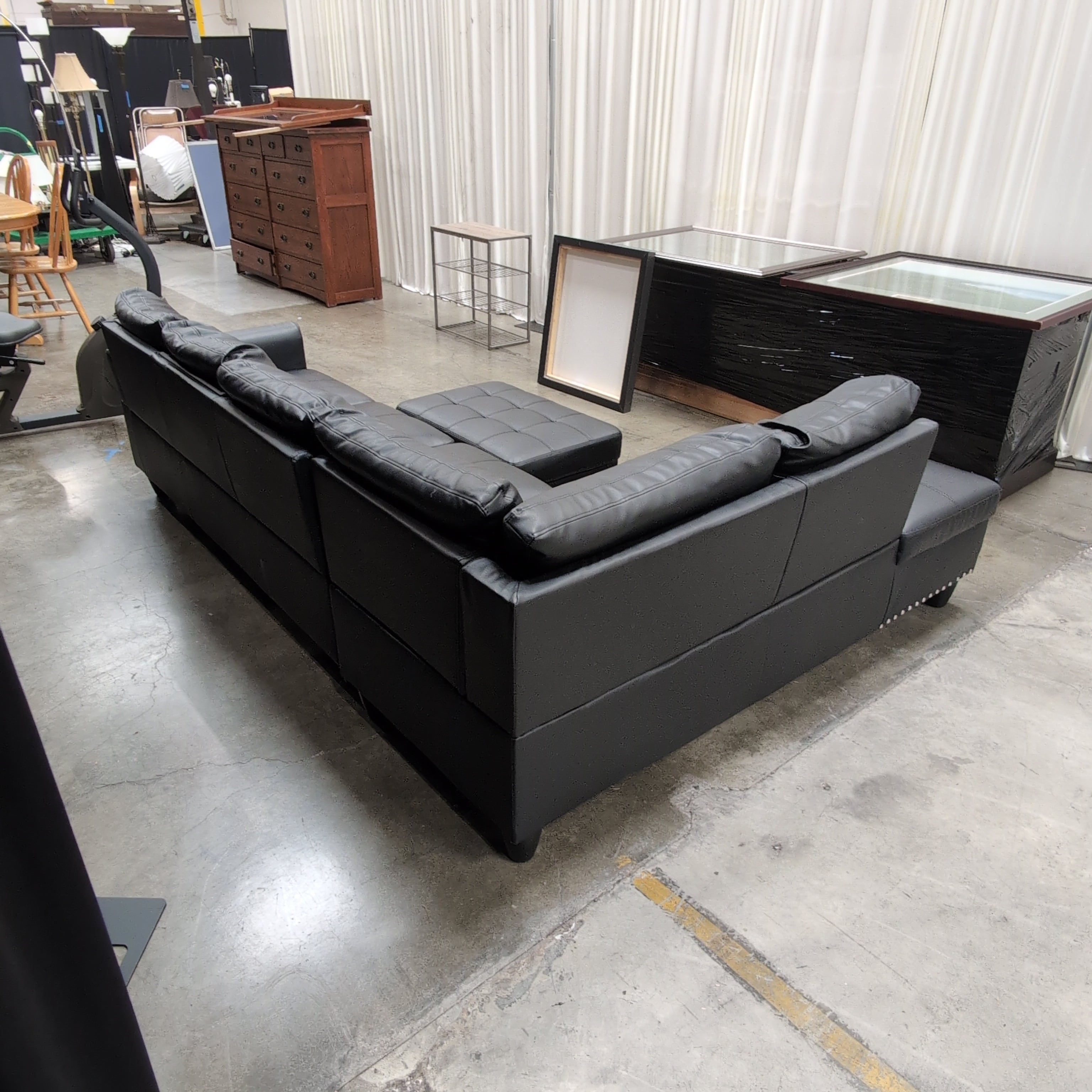 Black Faux Leather Sectional Couch with Ottoman