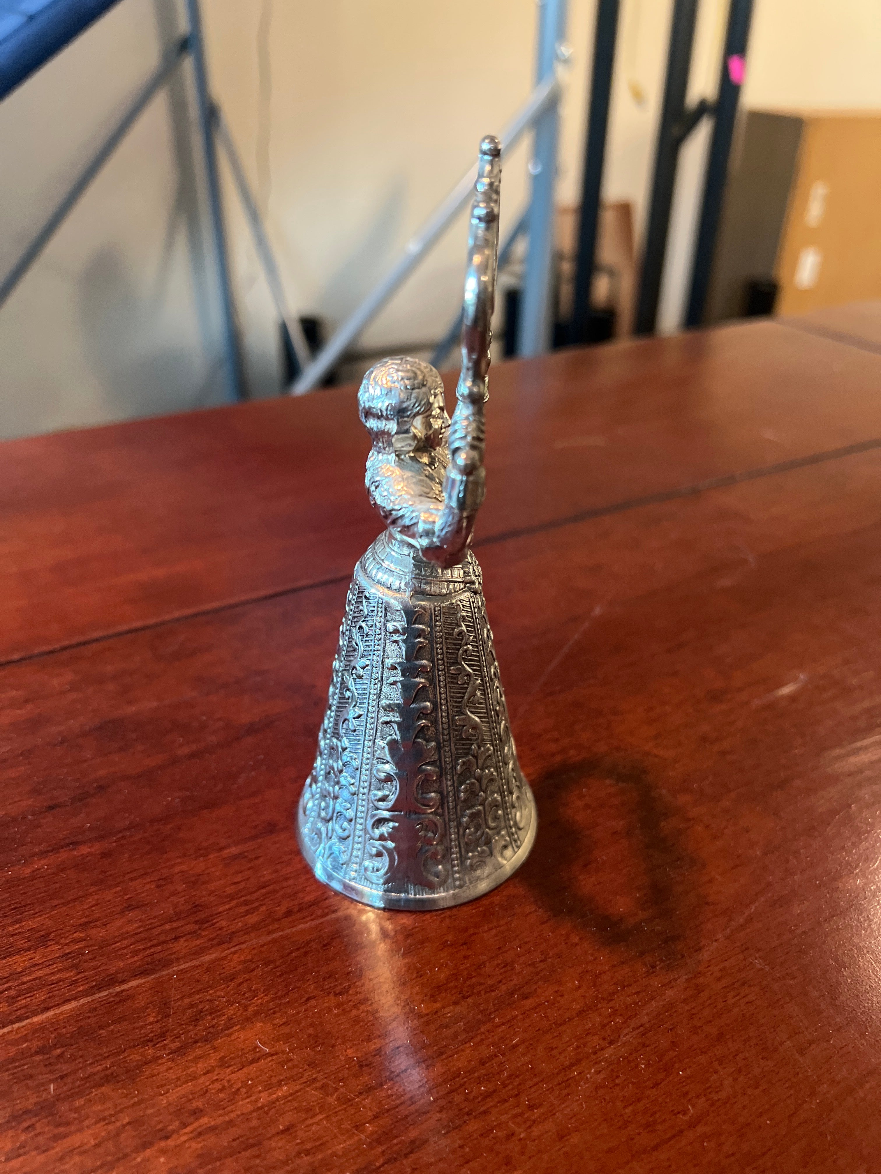 Ornate Metallic Decorative Bell with Sculpted Base