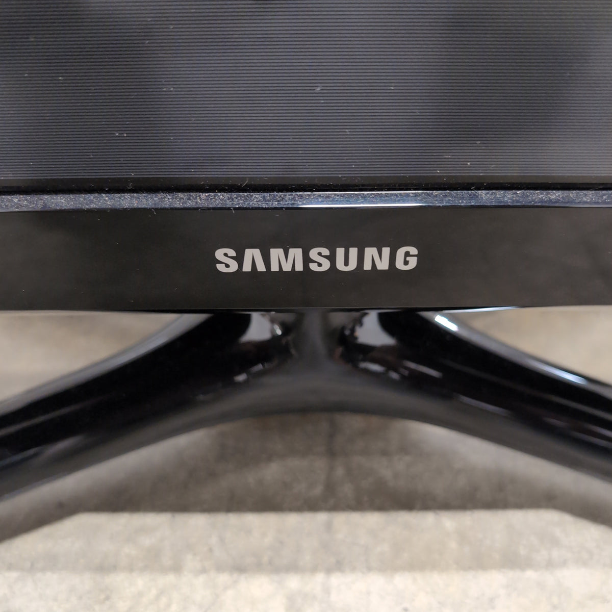 Samsung Black Flat Panel TV with Stand