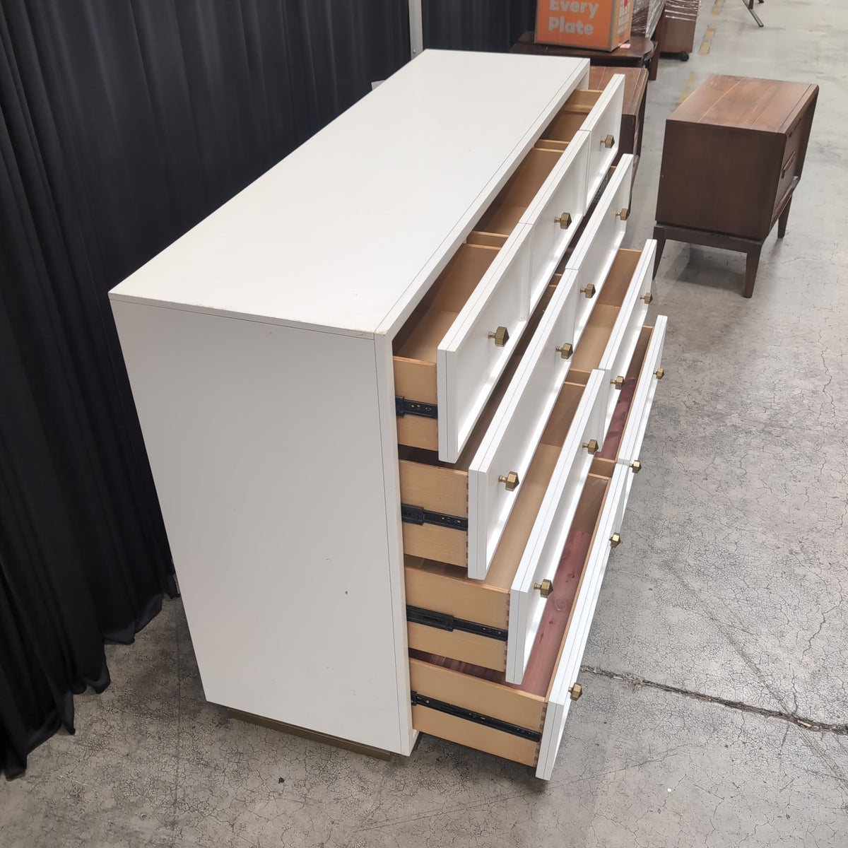 Clean-Lined White Nine-Drawer Dresser with Brass Knobs