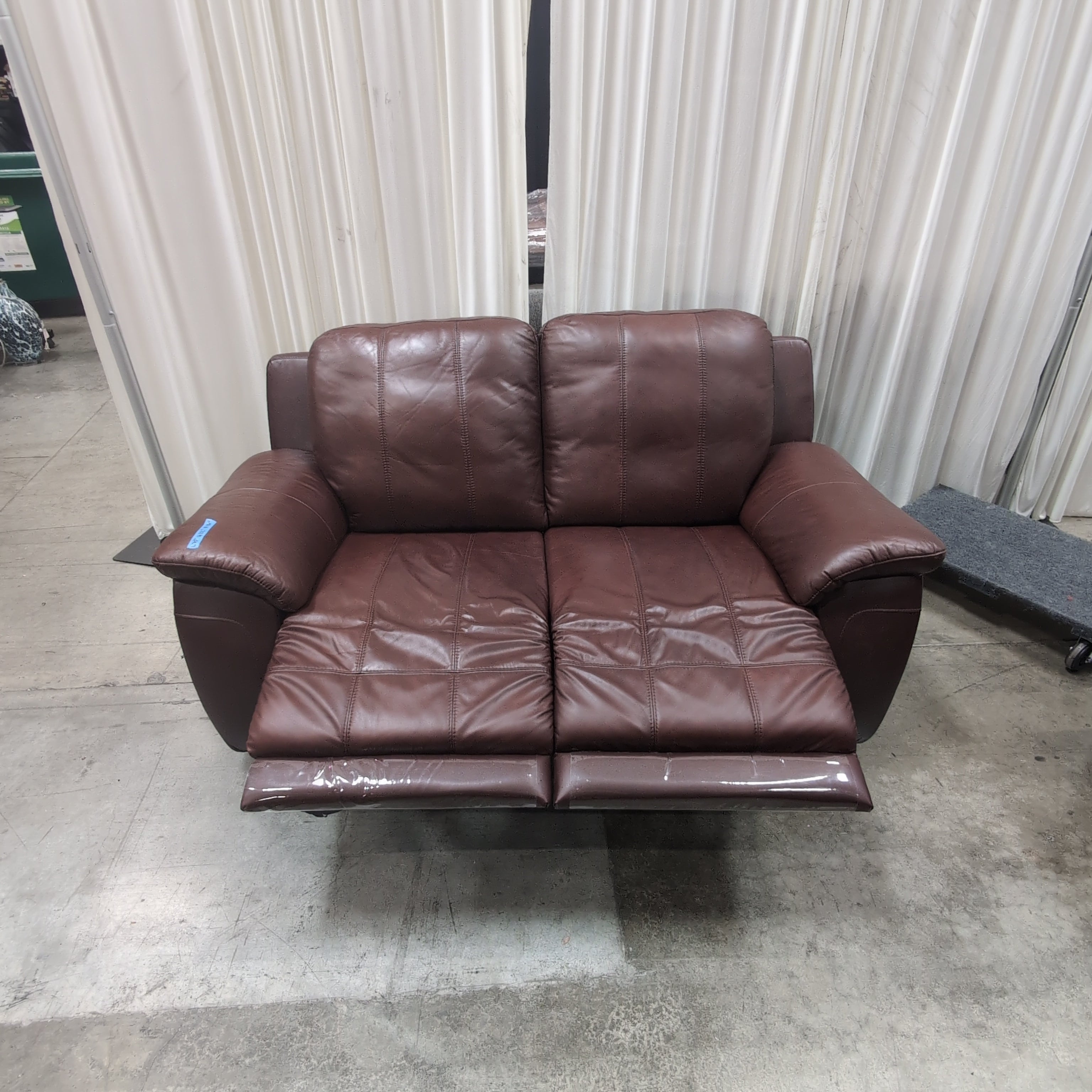 Deep Brown Leather Reclining Loveseat with Padded Arms