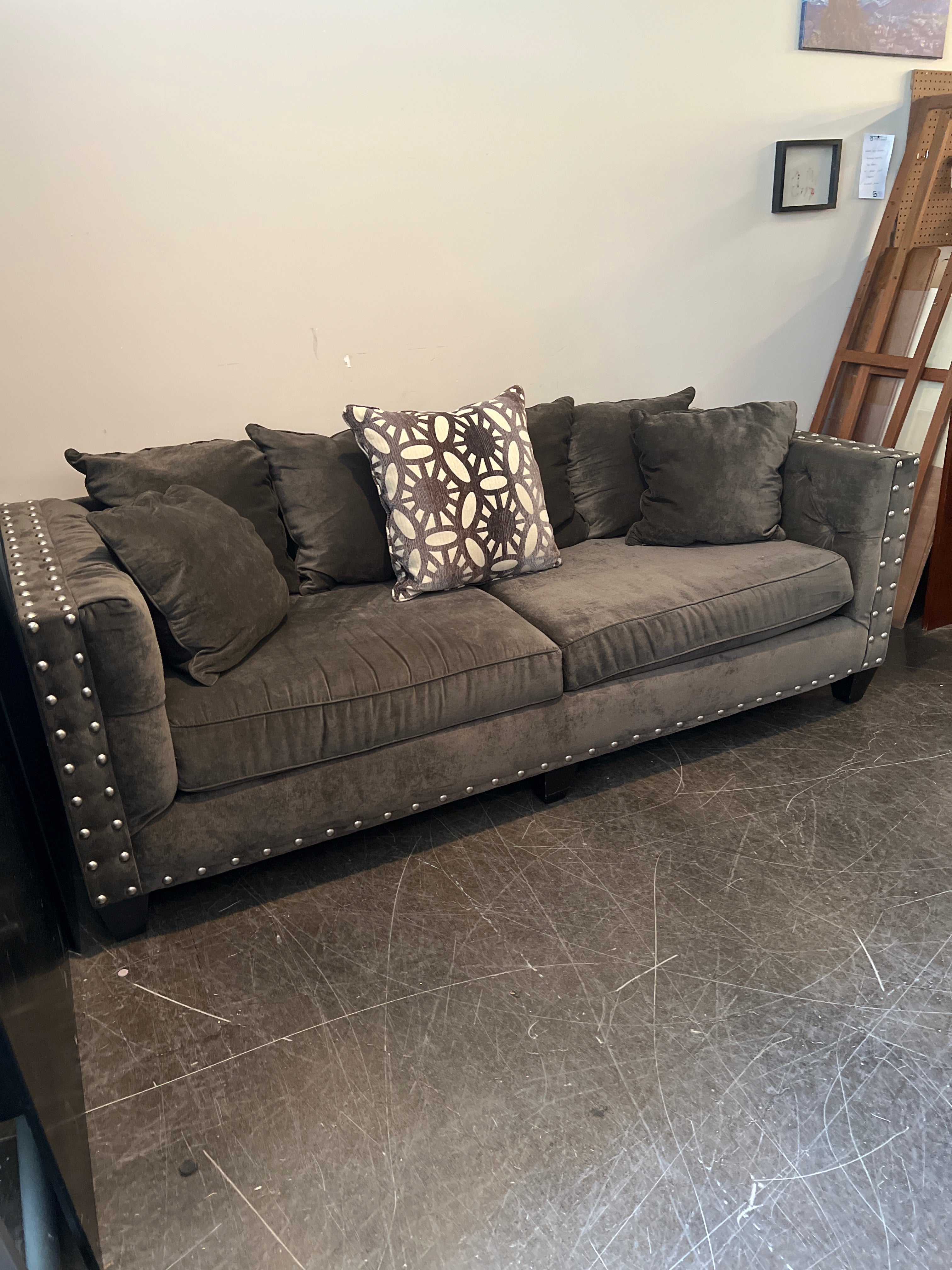 Dark Brown Tufted Sofa with Metal Accents