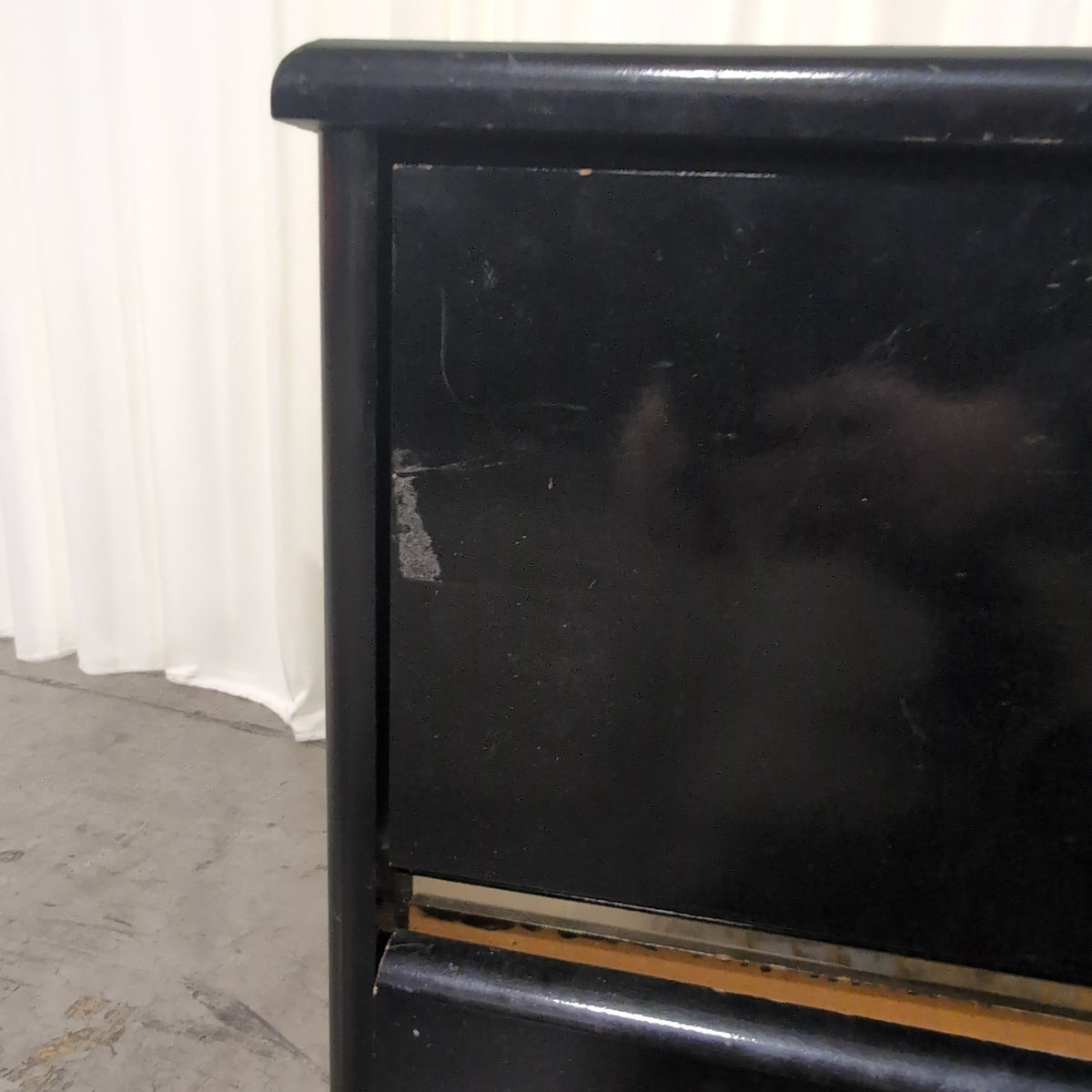 Black Lacquer Four-Drawer Dresser with Gold Pulls