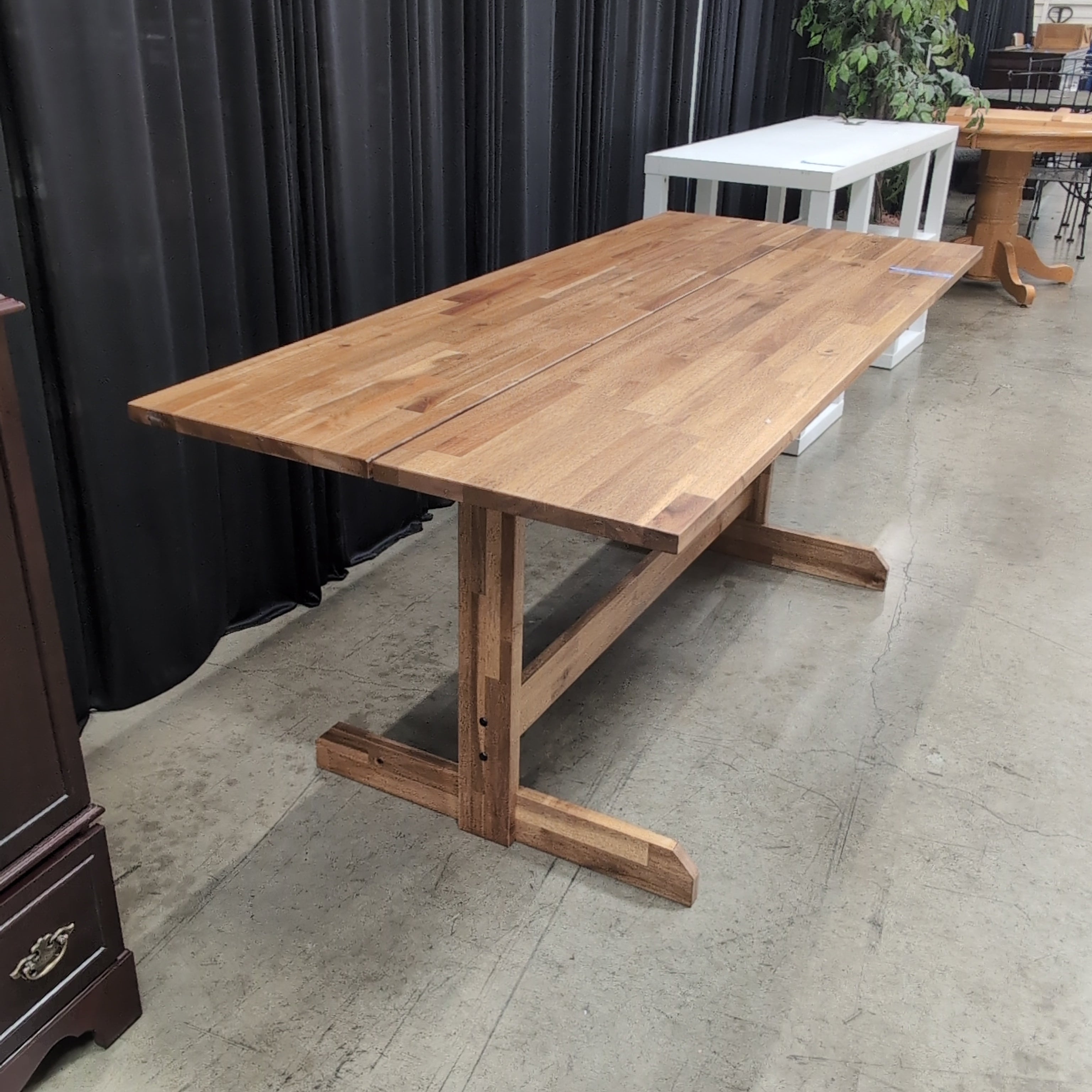 Warm Brown Wood Dining Table with Trestle Base