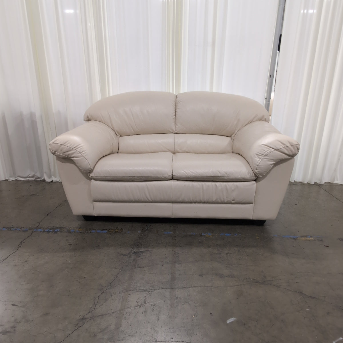 Cream Rolled Arm Loveseat in Leather