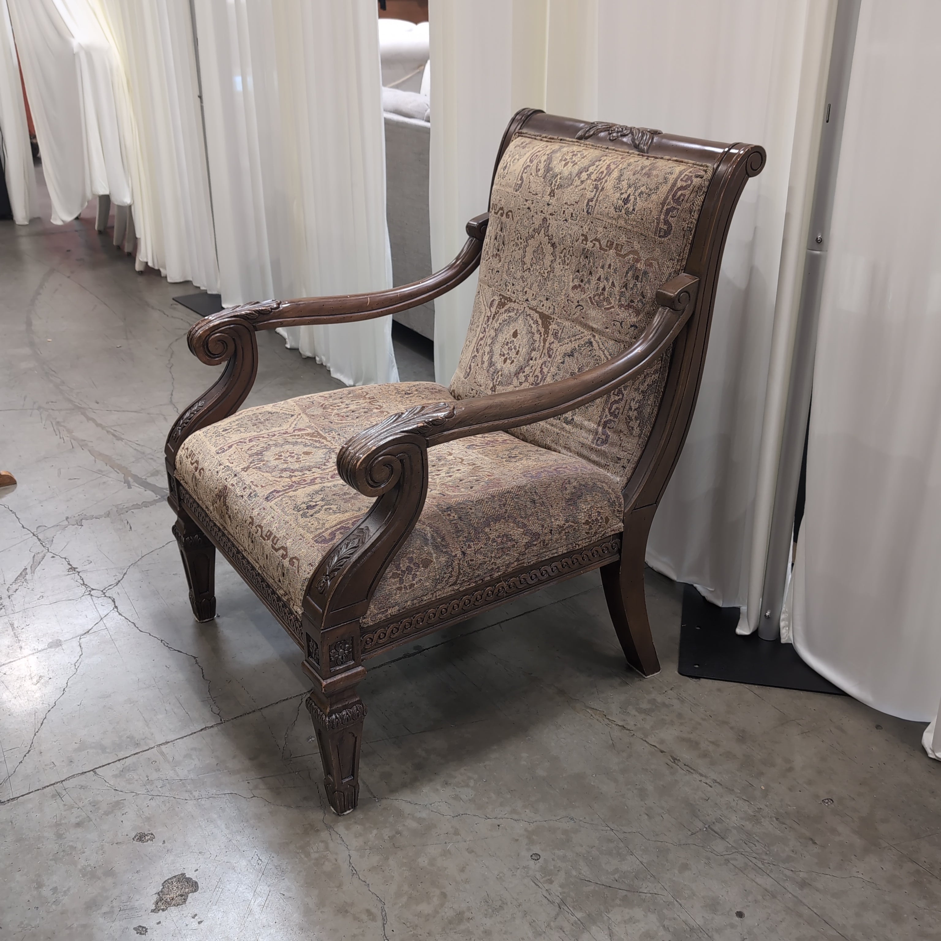 Traditional Carved Wood Accent Chair with Patterned Upholstery