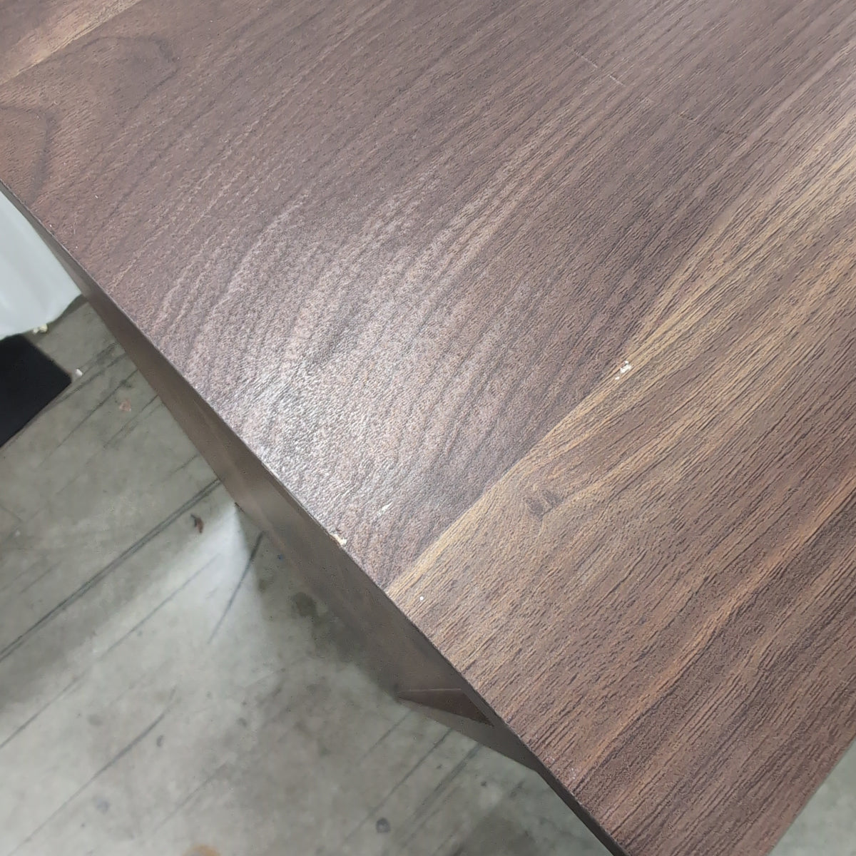 Dark Wood Four-Drawer Dresser with Metal Pulls