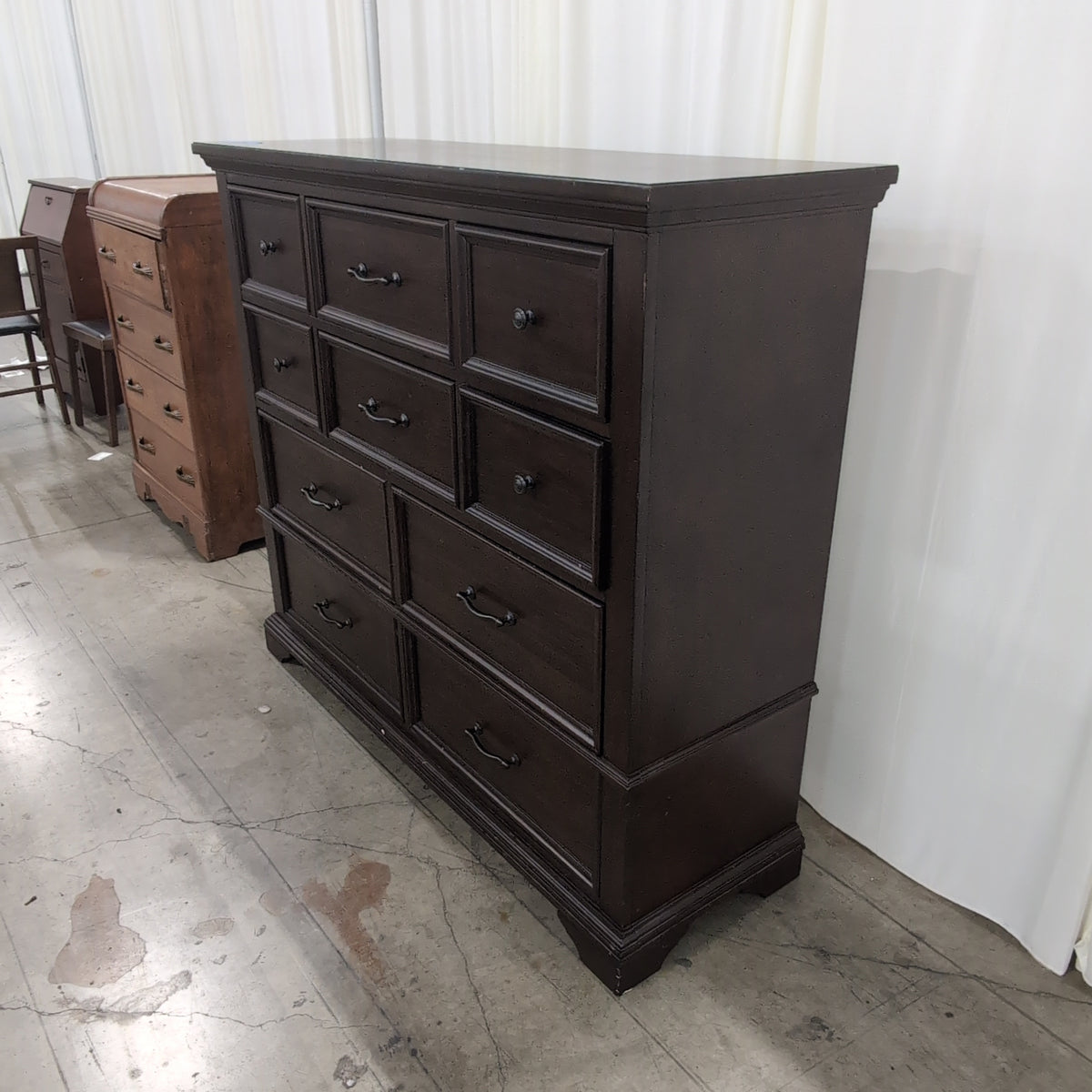 Dark Brown Wood Eight-Drawer Dresser with Ornate Hardware