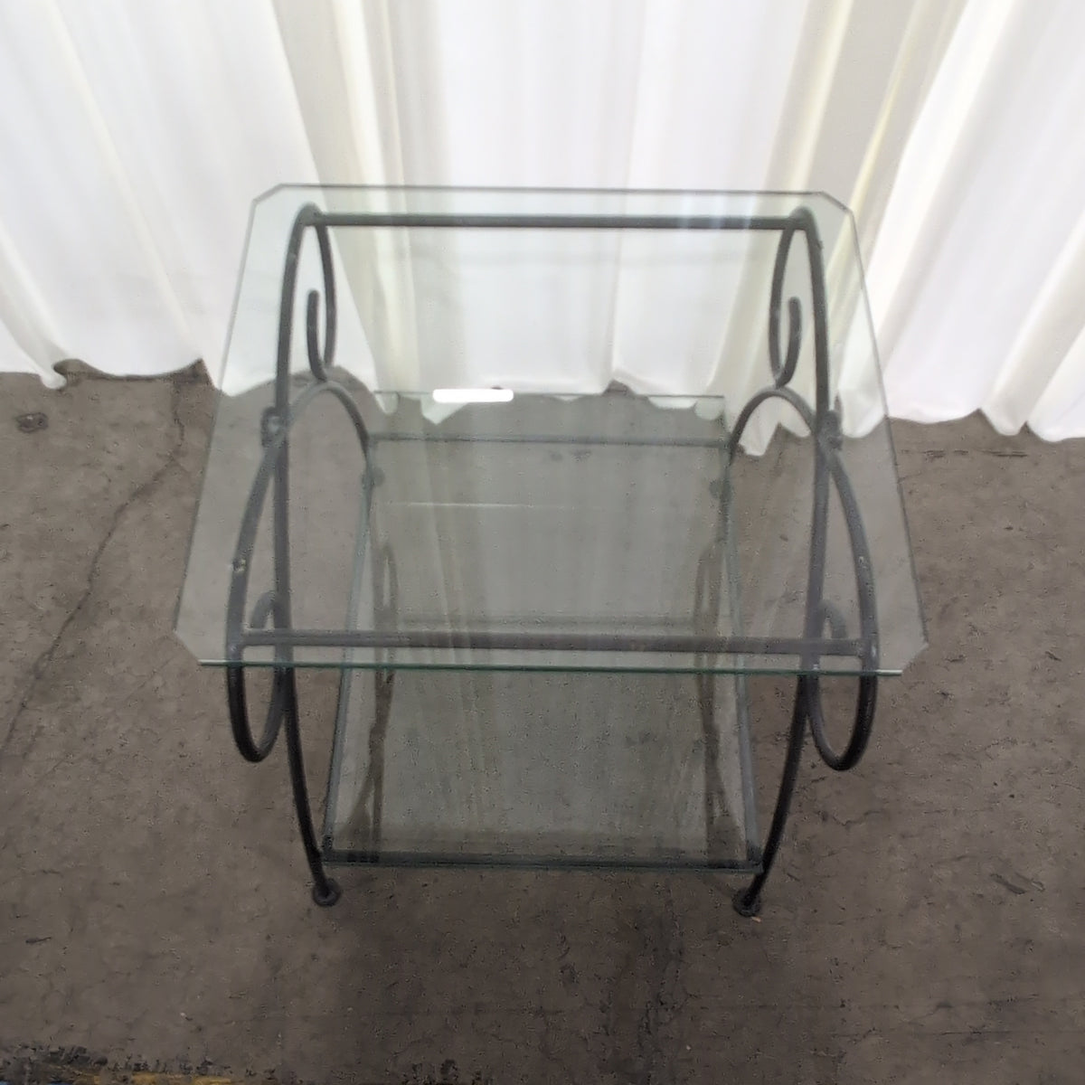Dark Metal Two-Tiered End Table with Glass Shelves