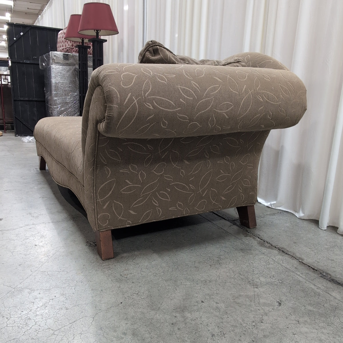 Tan Upholstered Chaise Lounge with Leaf Pattern