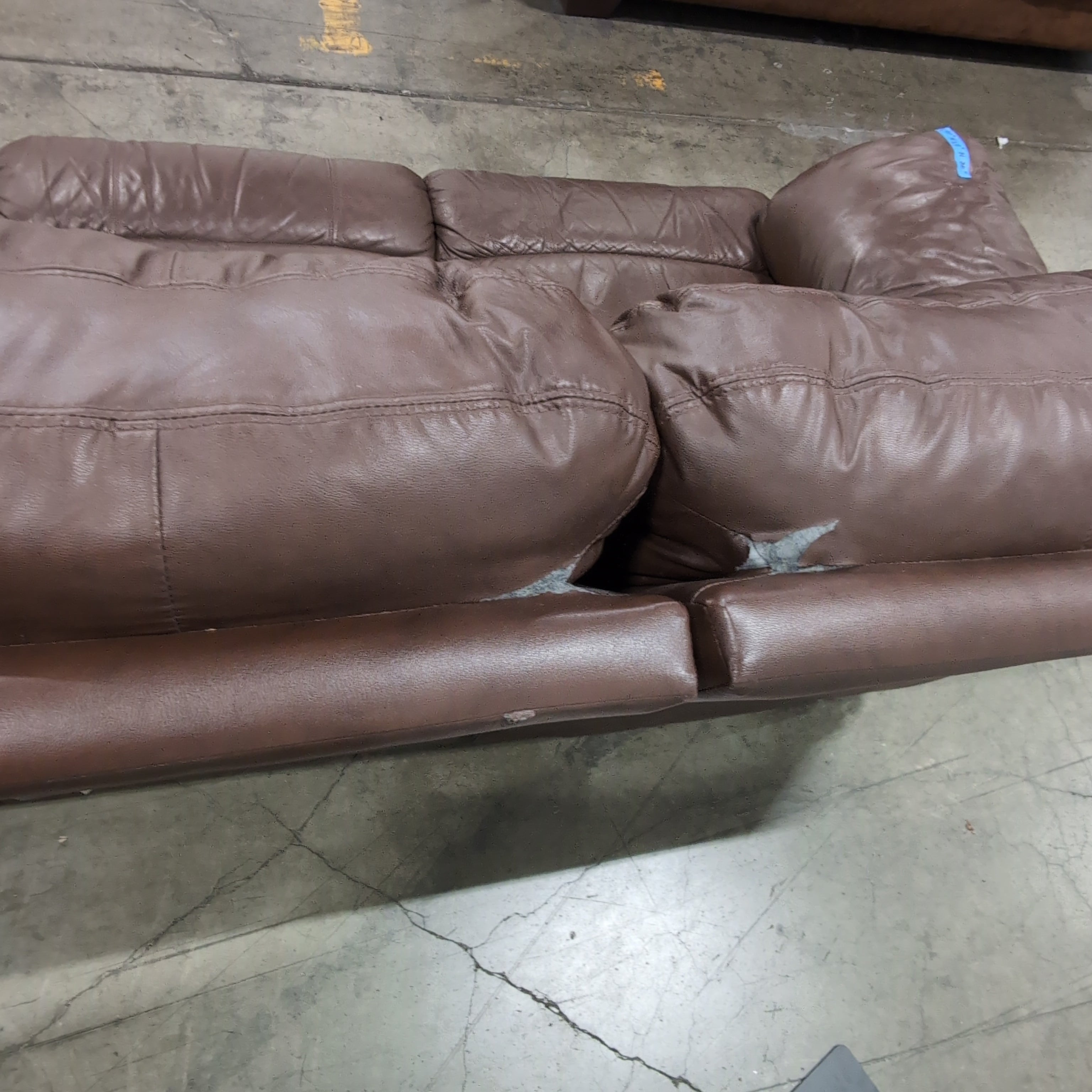 Brown Leather Three-Seat Recliner Couch