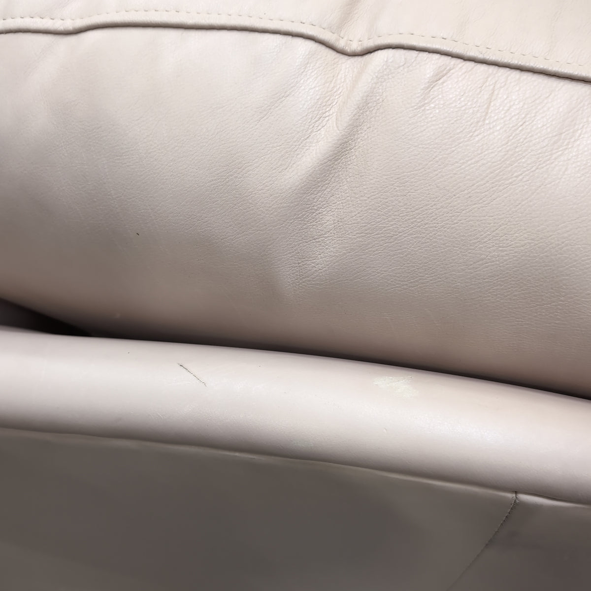 Padded Tan Armchair with Rolled Arms