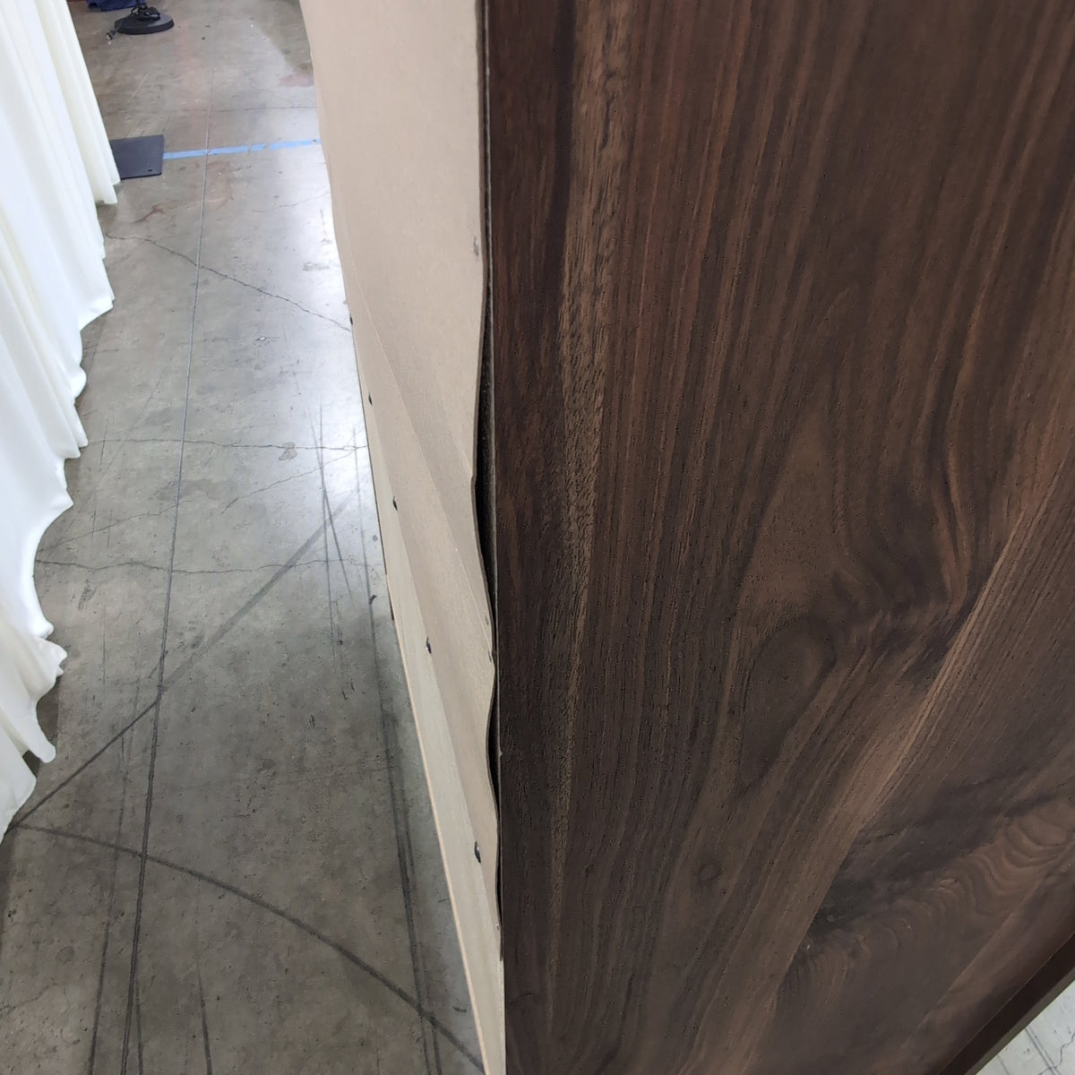 Dark Wood Four-Drawer Dresser with Metal Pulls