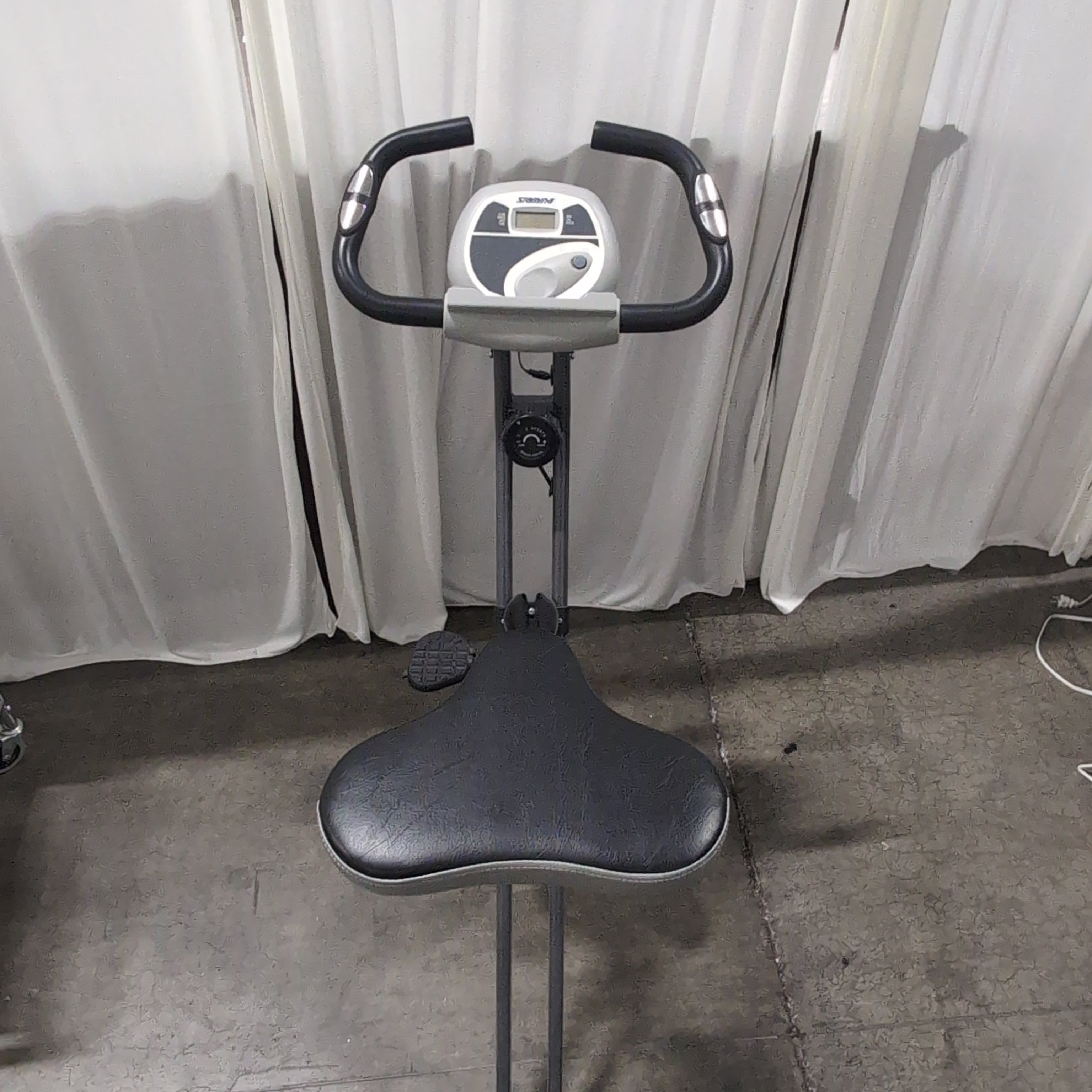 Compact Black Stationary Exercise Bike with Adjustable Seat