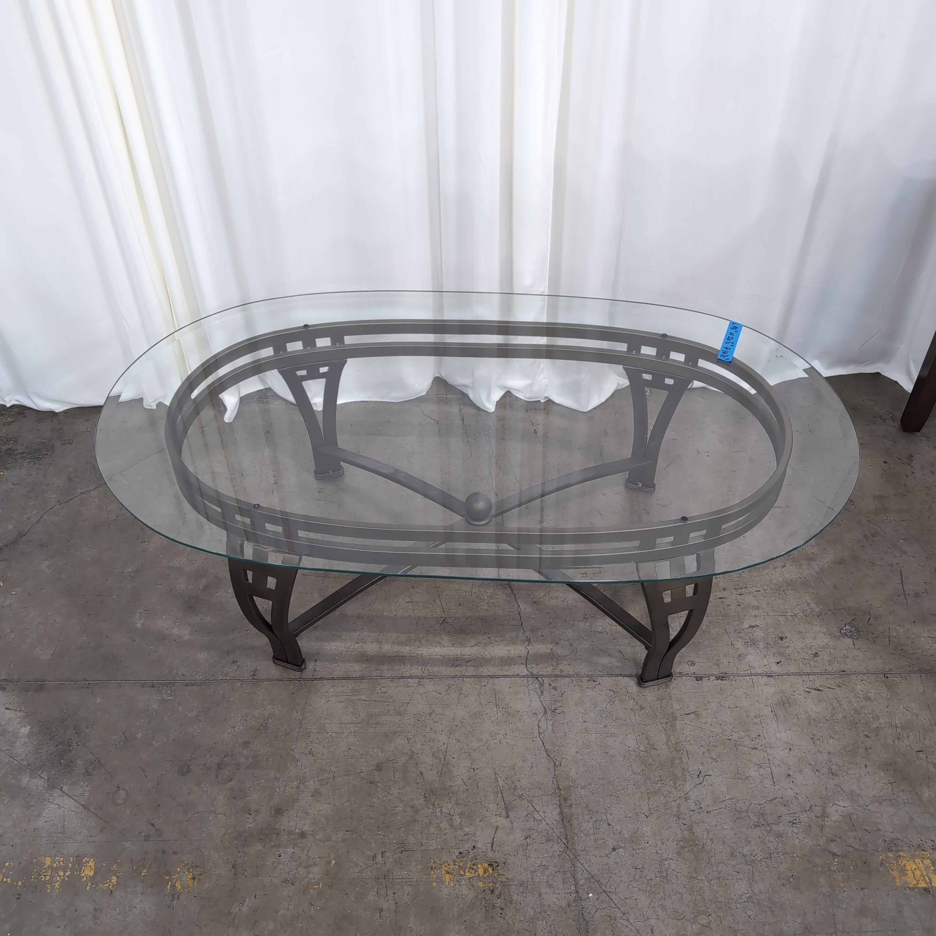 Oval Glass Coffee Table with Dark Metal Base