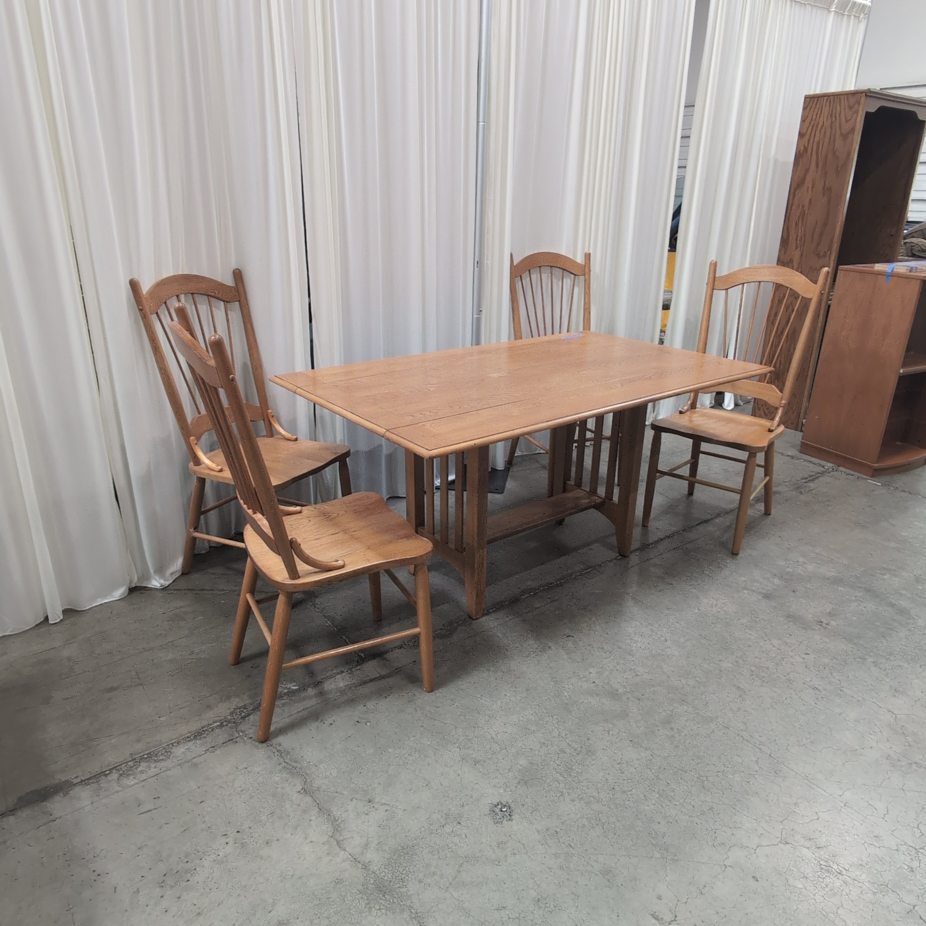 Oak Tone Drop Leaf Dining Table with Spindle Back Chairs