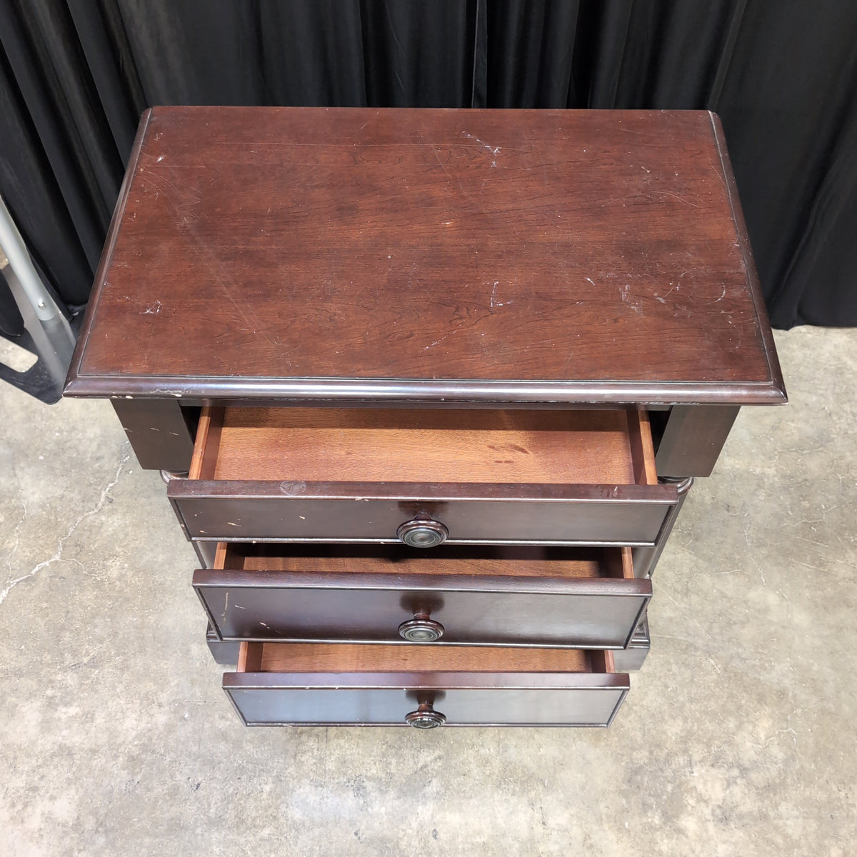 Dark Hardwood Three-Drawer Nightstand with Turned Columns