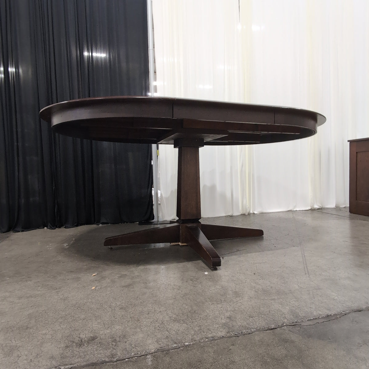 Cherry Tone Oval Wood Dining Table with Center Leaf