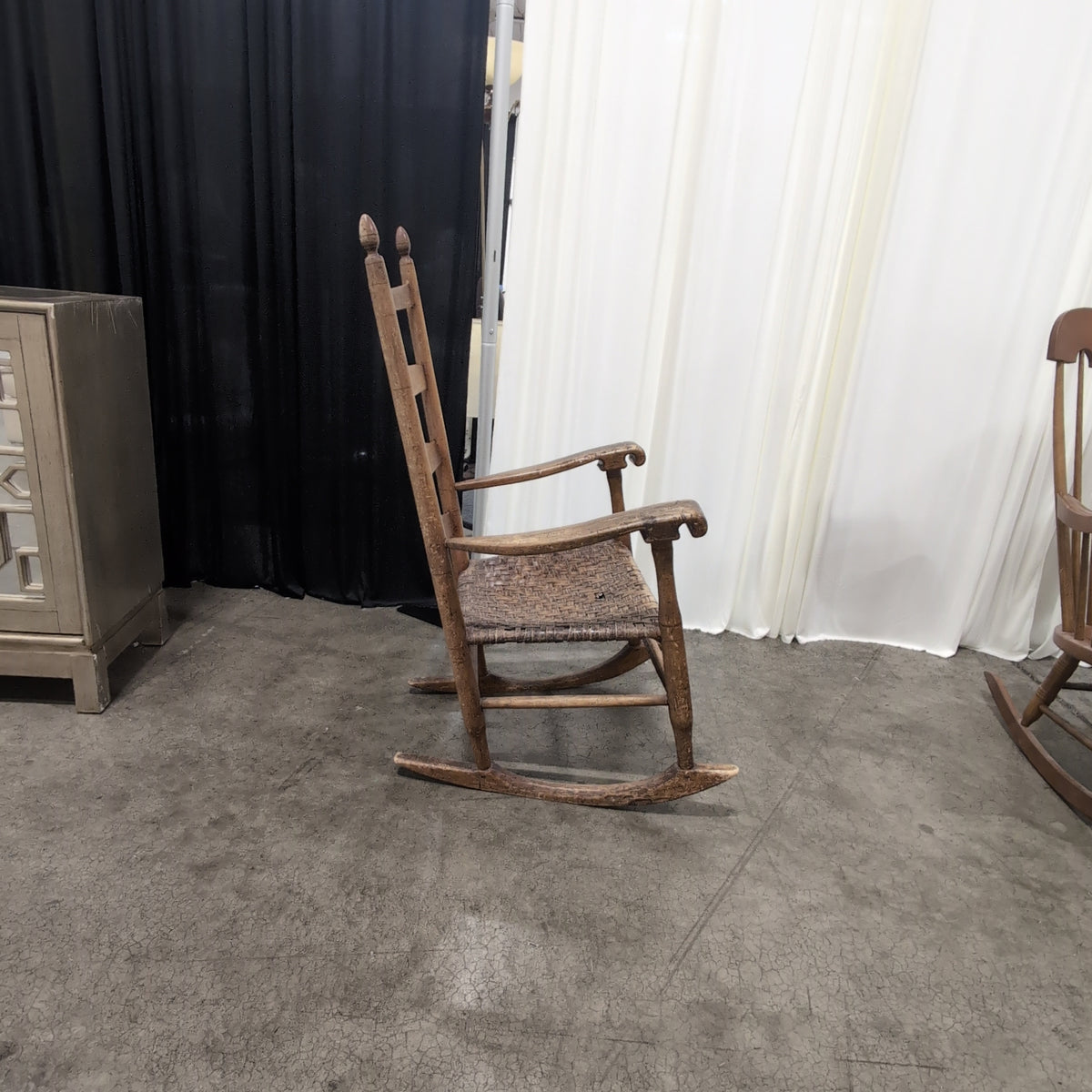 Brown Ladder-Back Rocking Chair with Woven Seat