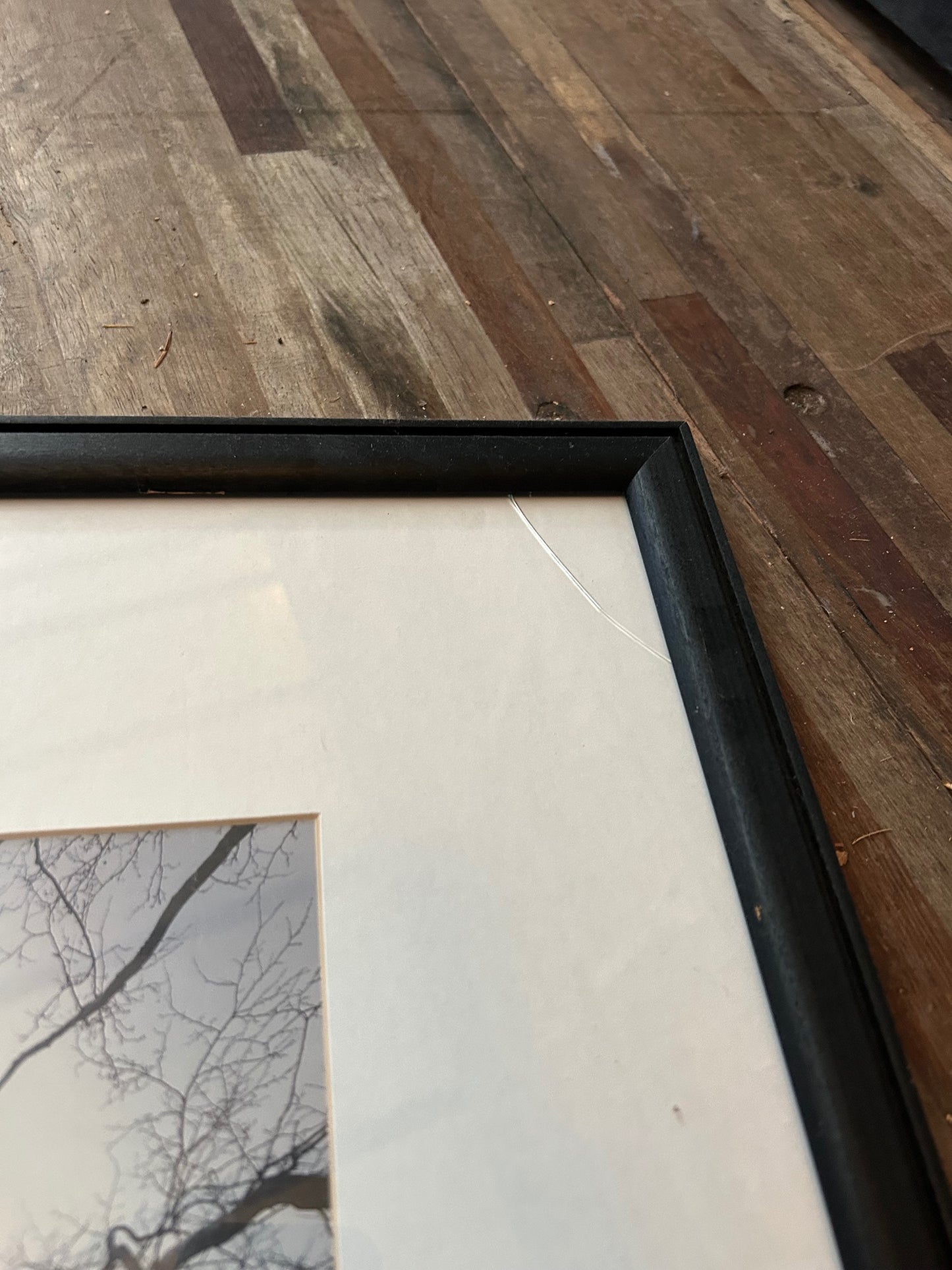 Black And White City Photo With Broken Corner on Frame