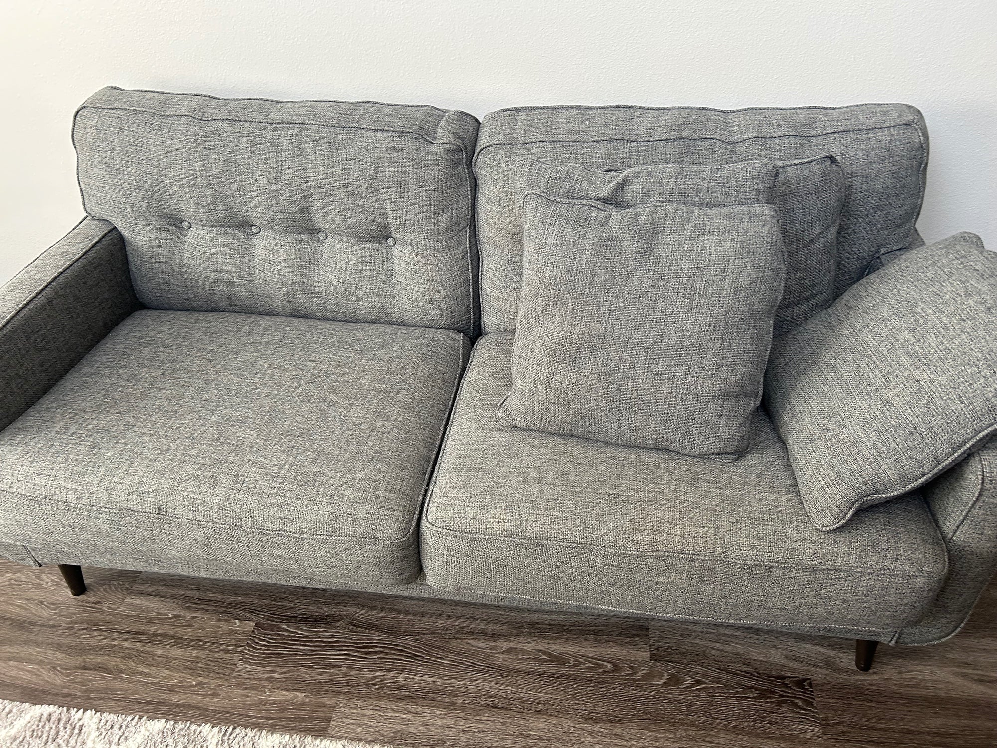 Large Gray Sofa with Tufted Back