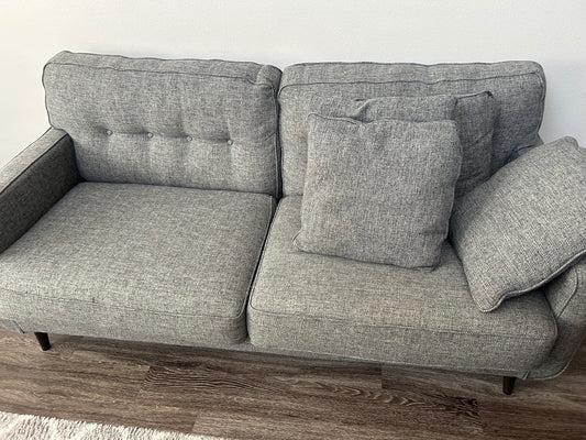 Large Gray Sofa with Tufted Back