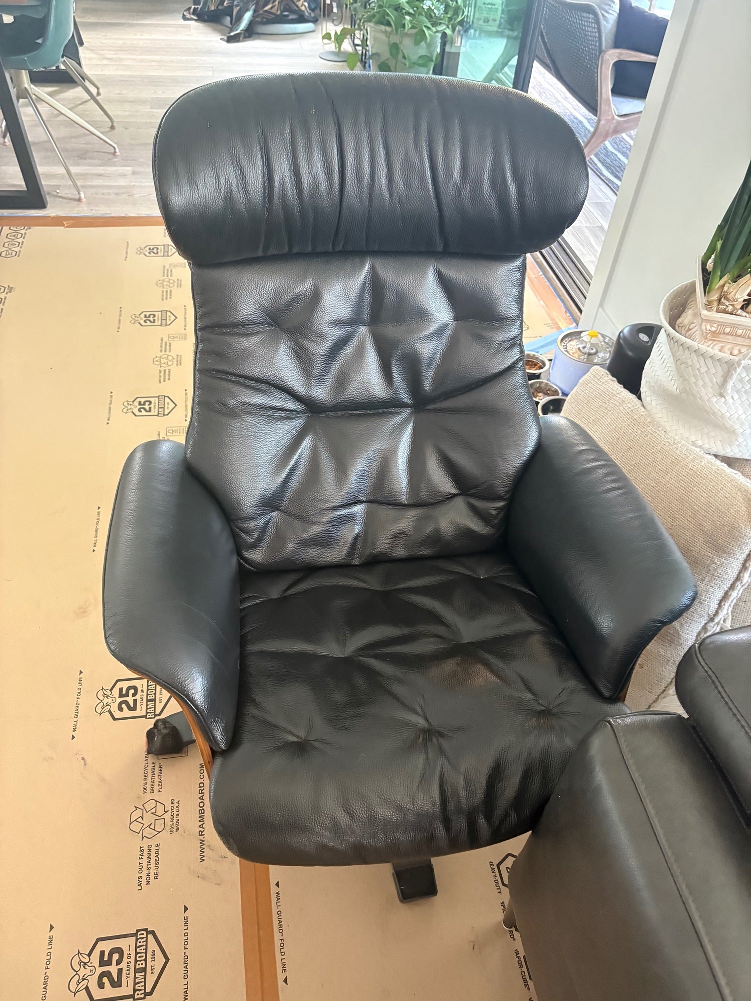 Luxurious Black Leather Recliner and Ottoman Set