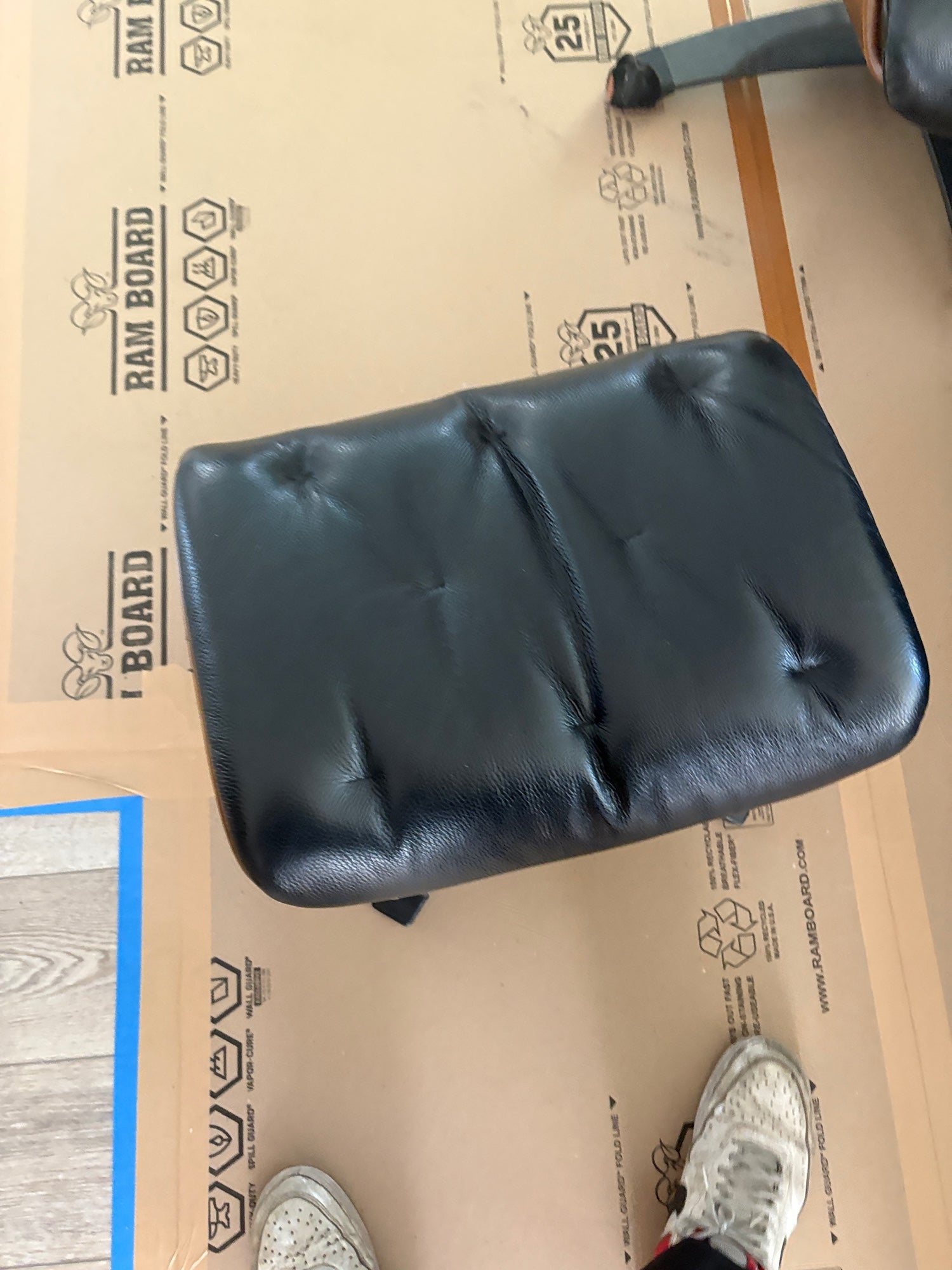 Luxurious Black Leather Recliner and Ottoman Set