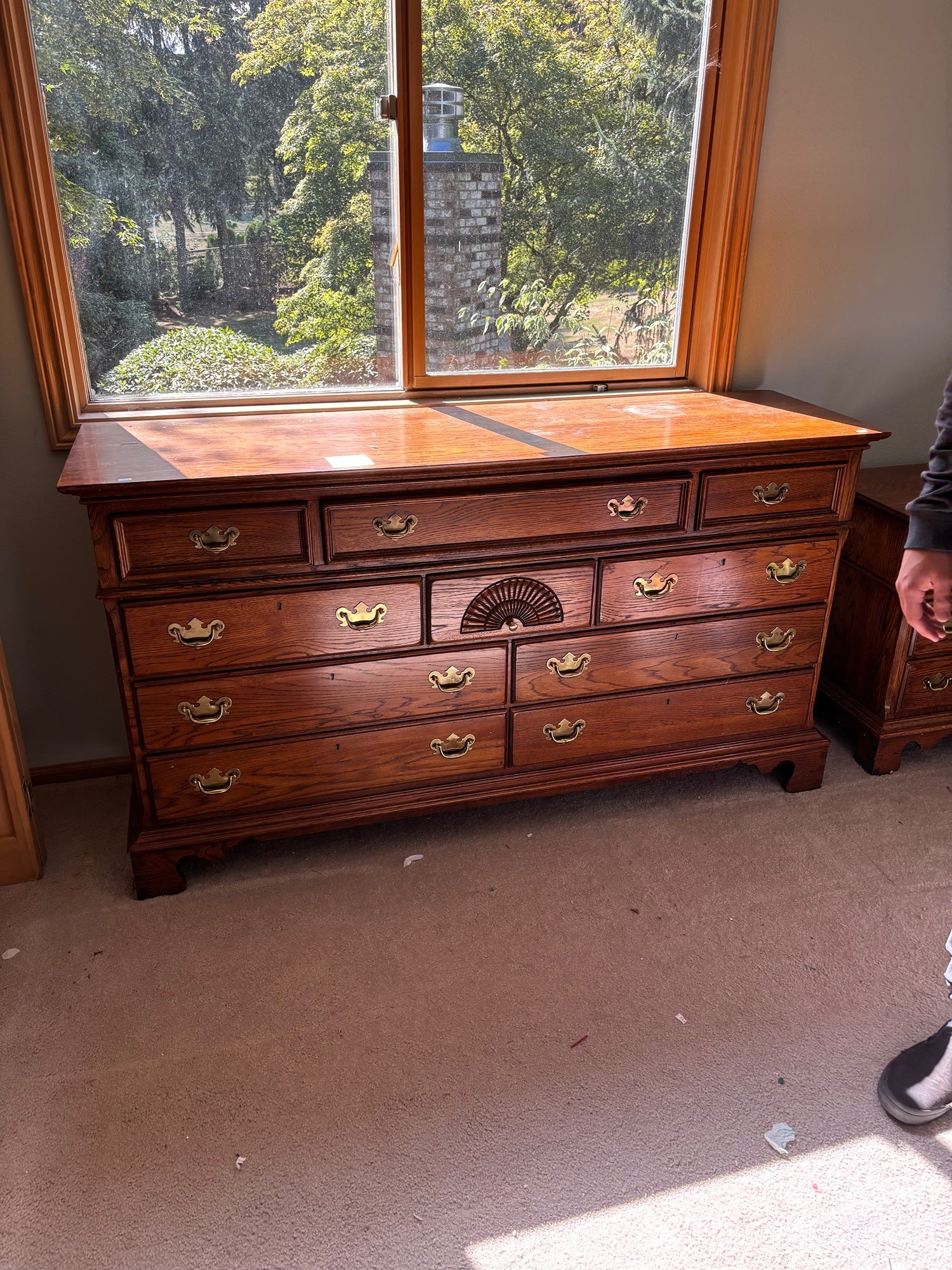 Richly-Toned Wood Dresser with Carved Center Drawer