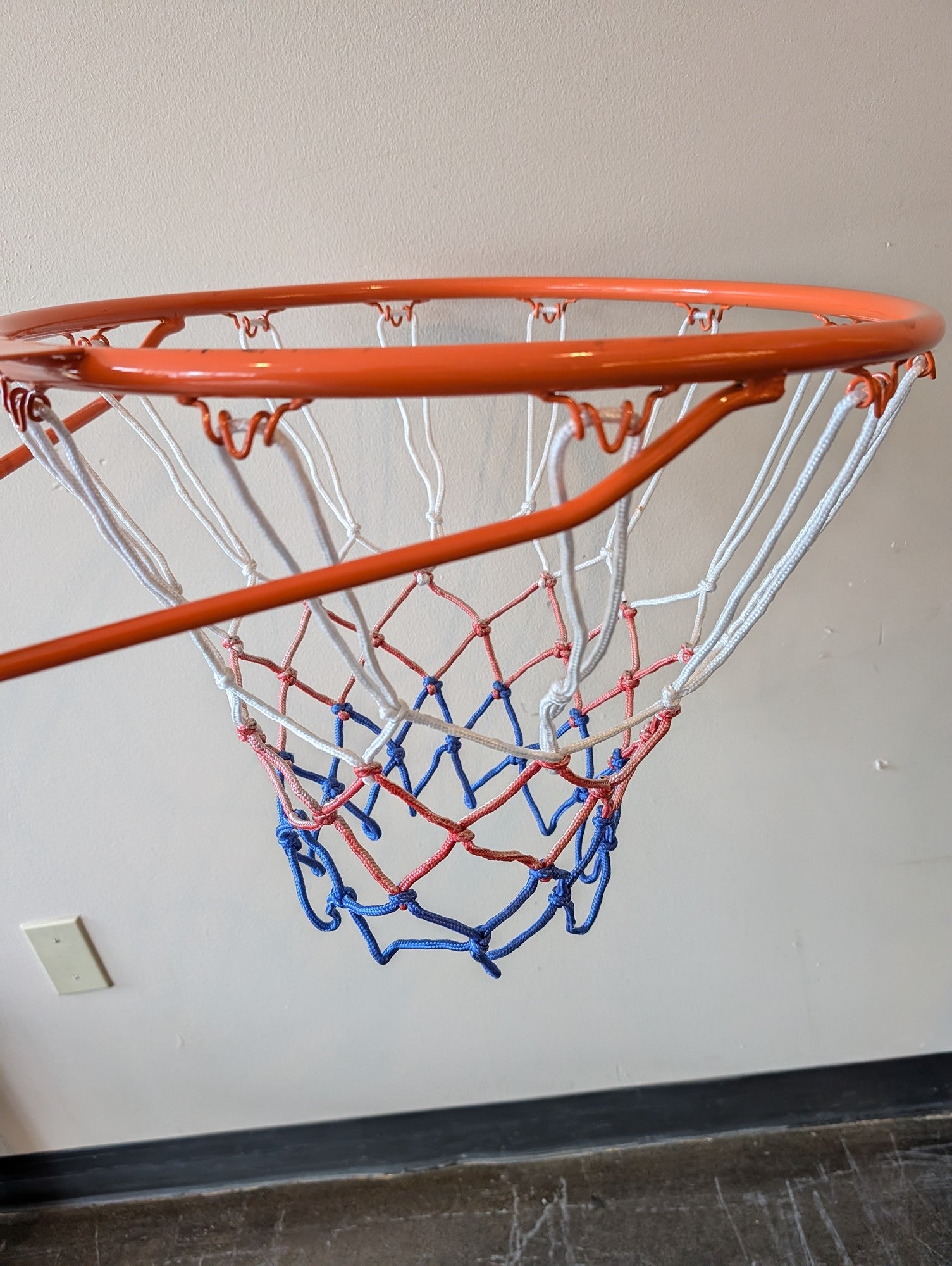 Vibrant Orange Basketball Hoop with Patriotic Net
