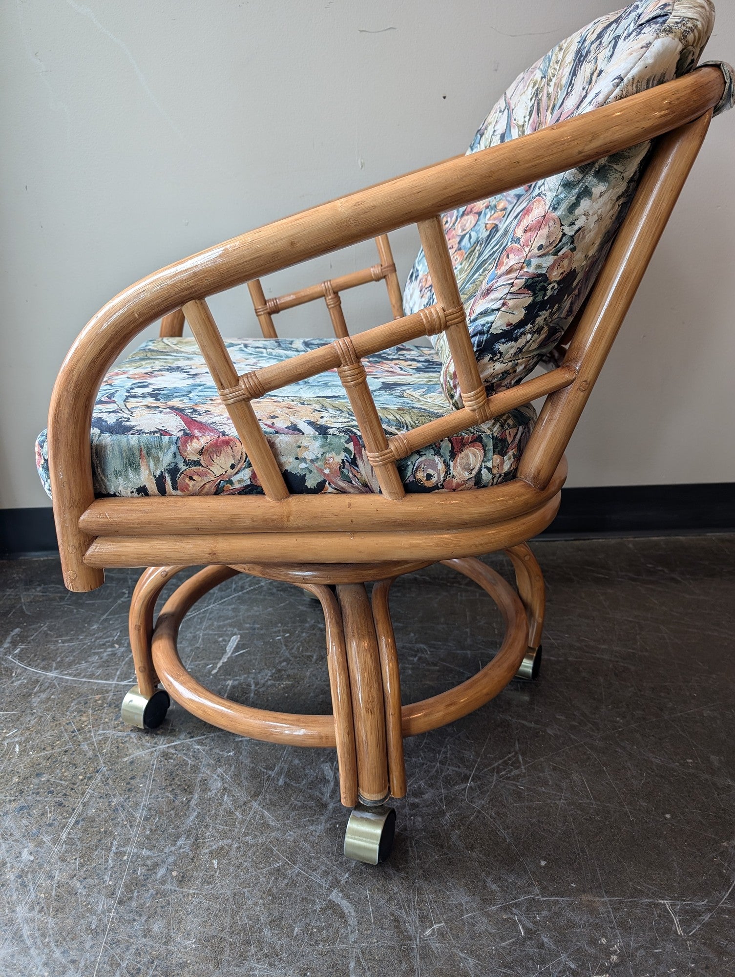 Vintage Rattan Swivel Caster Chair with Tropical Floral Cushions