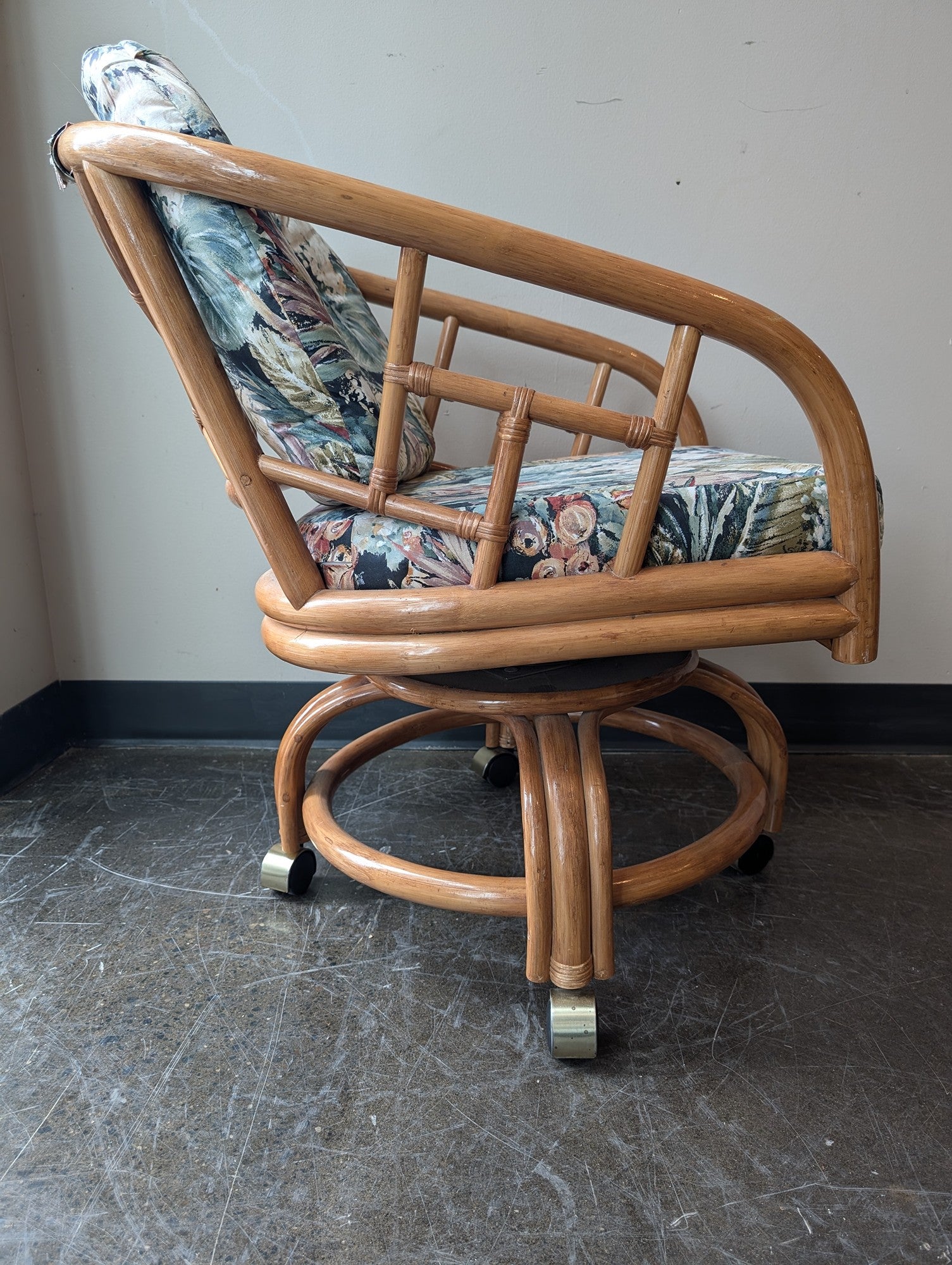 Vintage Rattan Swivel Caster Chair with Tropical Floral Cushions