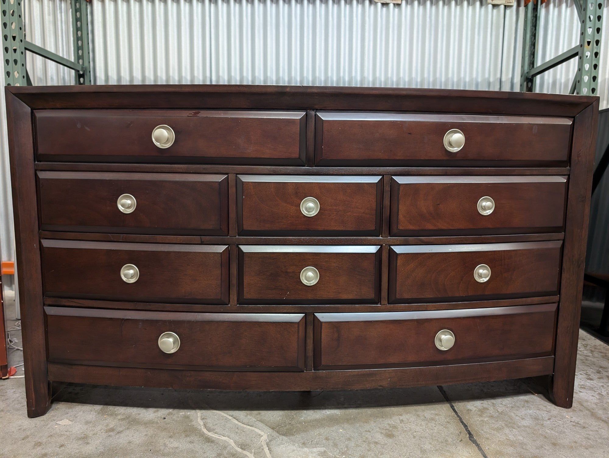 Dark Wood Curved Front Nine-Drawer Dresser