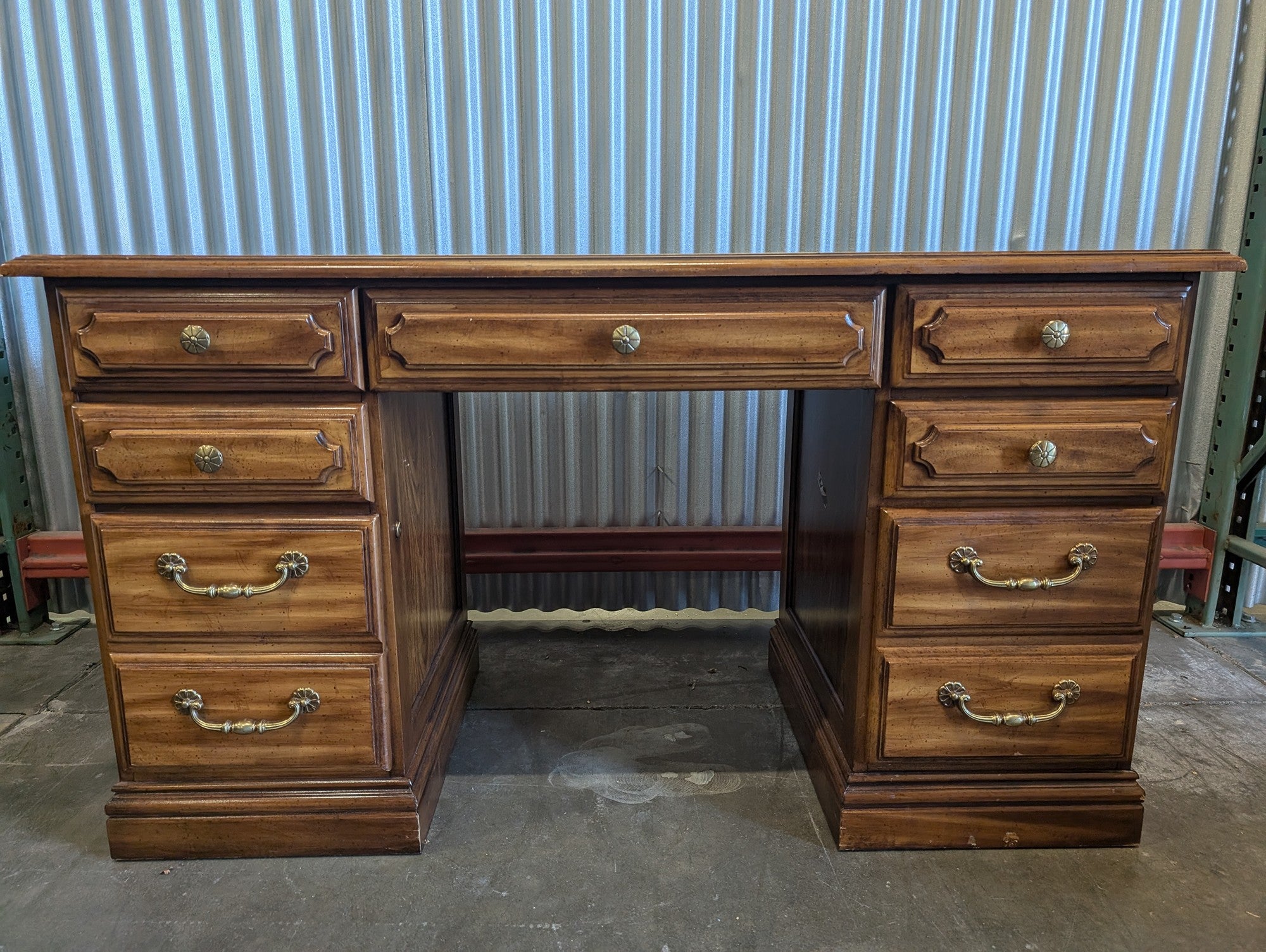 Light wood seven drawer desk